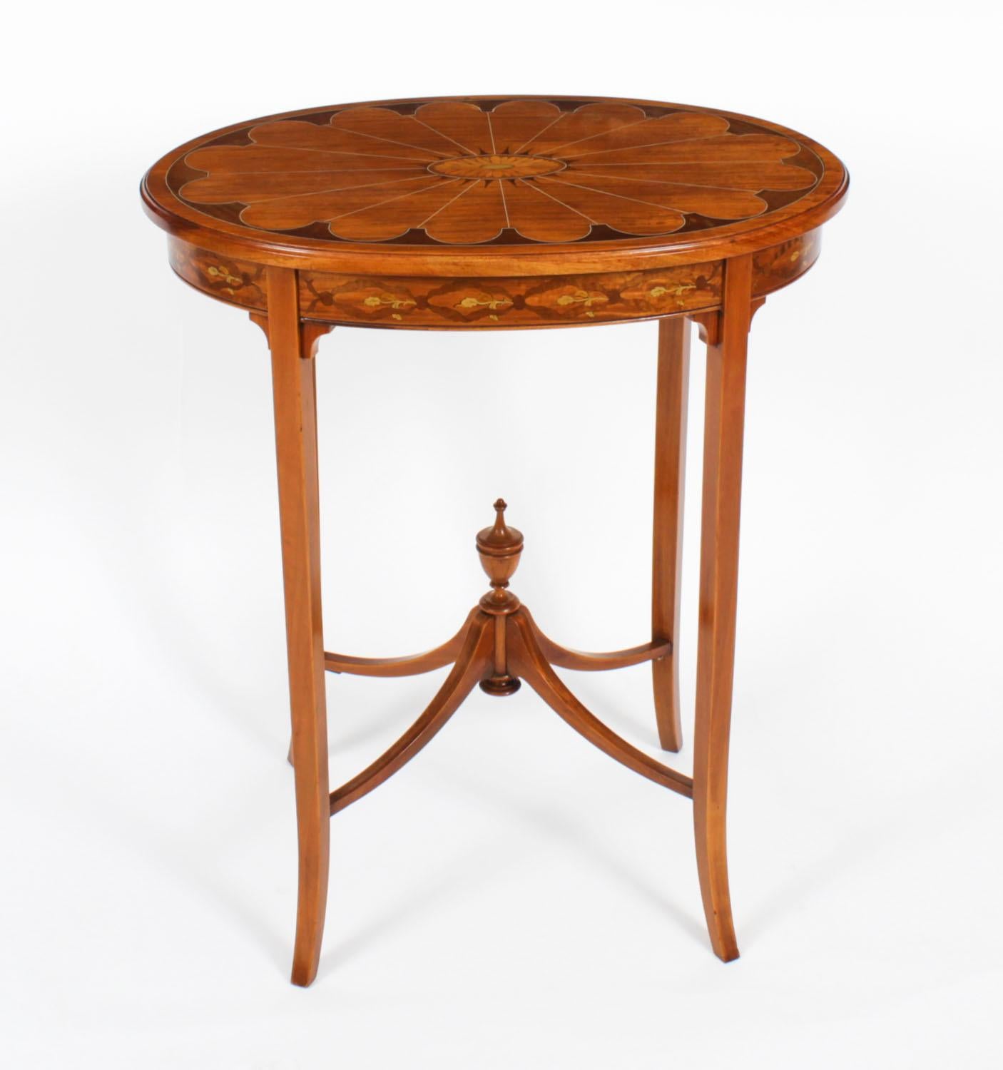 This is a superb antique satin wood  oval occasional table, circa 1880 in date.

The table is exquisitely crafted in rich satin wood, it features oval marquetry with boxwood line inlaid decoration throughout,  and is raised on square tapering legs