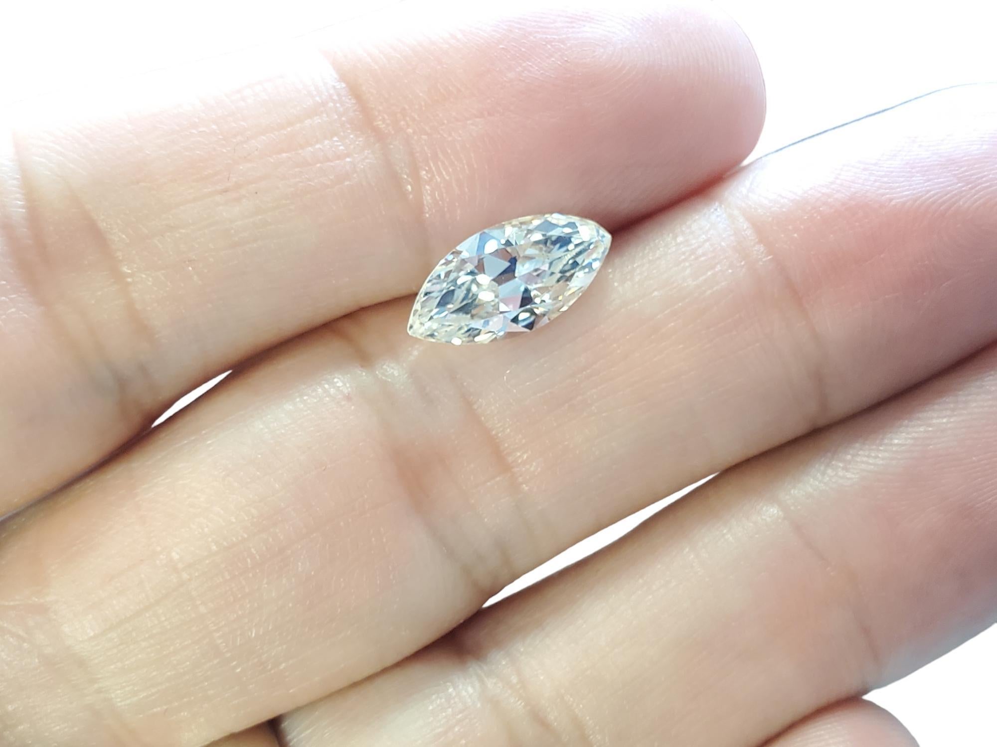 Listed is a very tough to find antique marquise cut natural diamond. This is a true old stone, bruted girdle (not polished...showing its age), open culet and older faceting. The diamond weighs 2.19(9)ct, it could go 2.19 or 2.20 depending on the