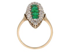 Antique marquise shape emerald and diamond ring, circa 1900.