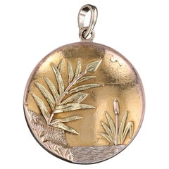 Pendentif marsh antique en or tricolore 14 carats
