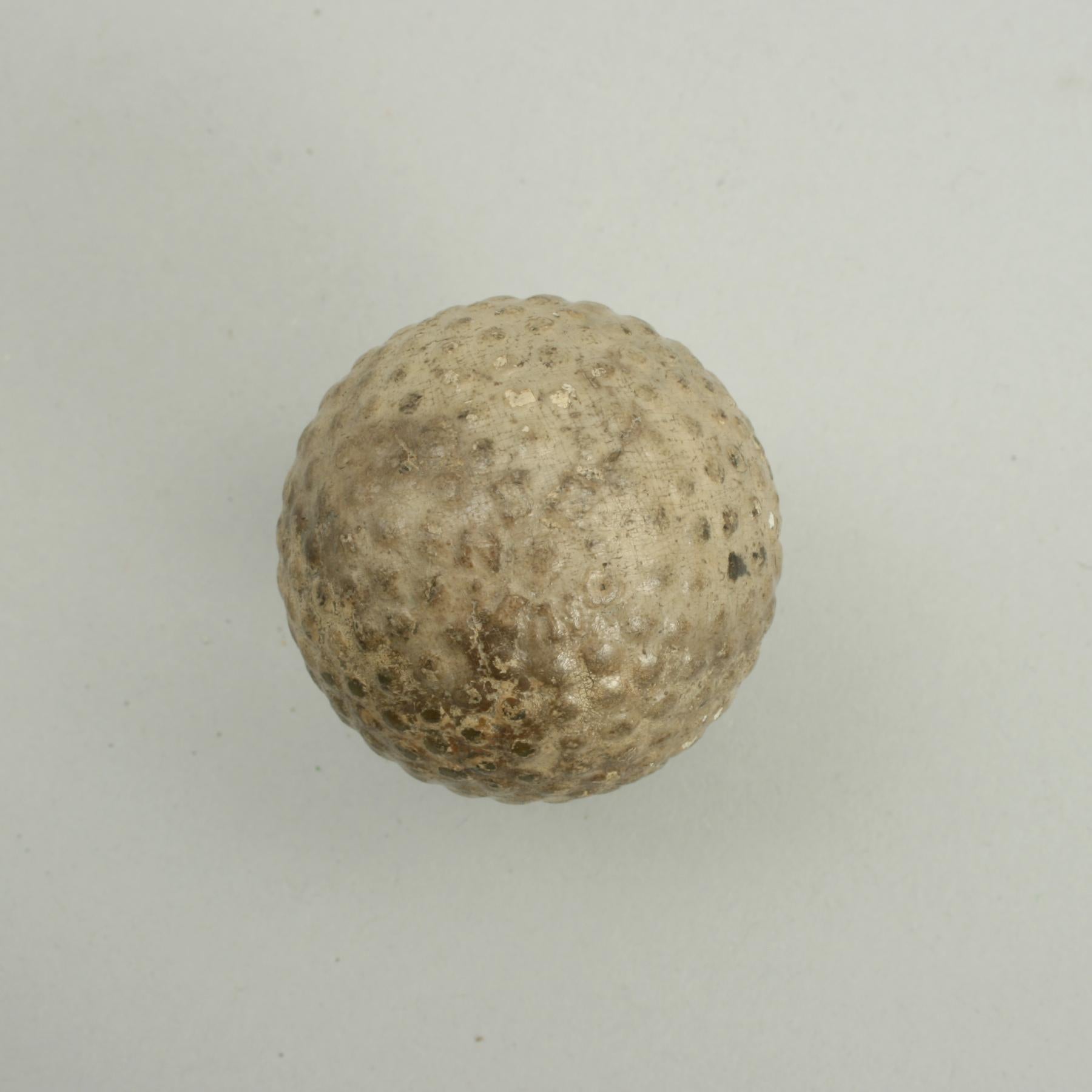 Martins bramble 'Zodiac' golf ball.
A good example of a 'Zodiac' bramble patterned rubber core golf ball. The golf ball is in fair condition and is manufactured by Martins, England, circa 1906. The ball is marked 'Zodiac' on one pole and 'ZBZ ENG'