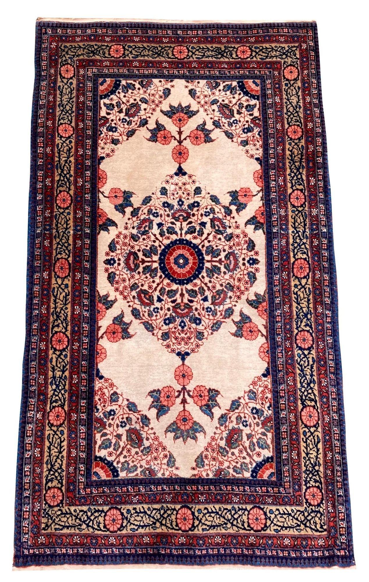 A lovely antique Mashad rug, handwoven circa 1920 with an elegantly drawn floral design on an ivory field and interesting gold border. Very finely woven with lovely wool quality and great secondary colours.
Size: 1.34m x 0.79m (4ft 5in x 2ft