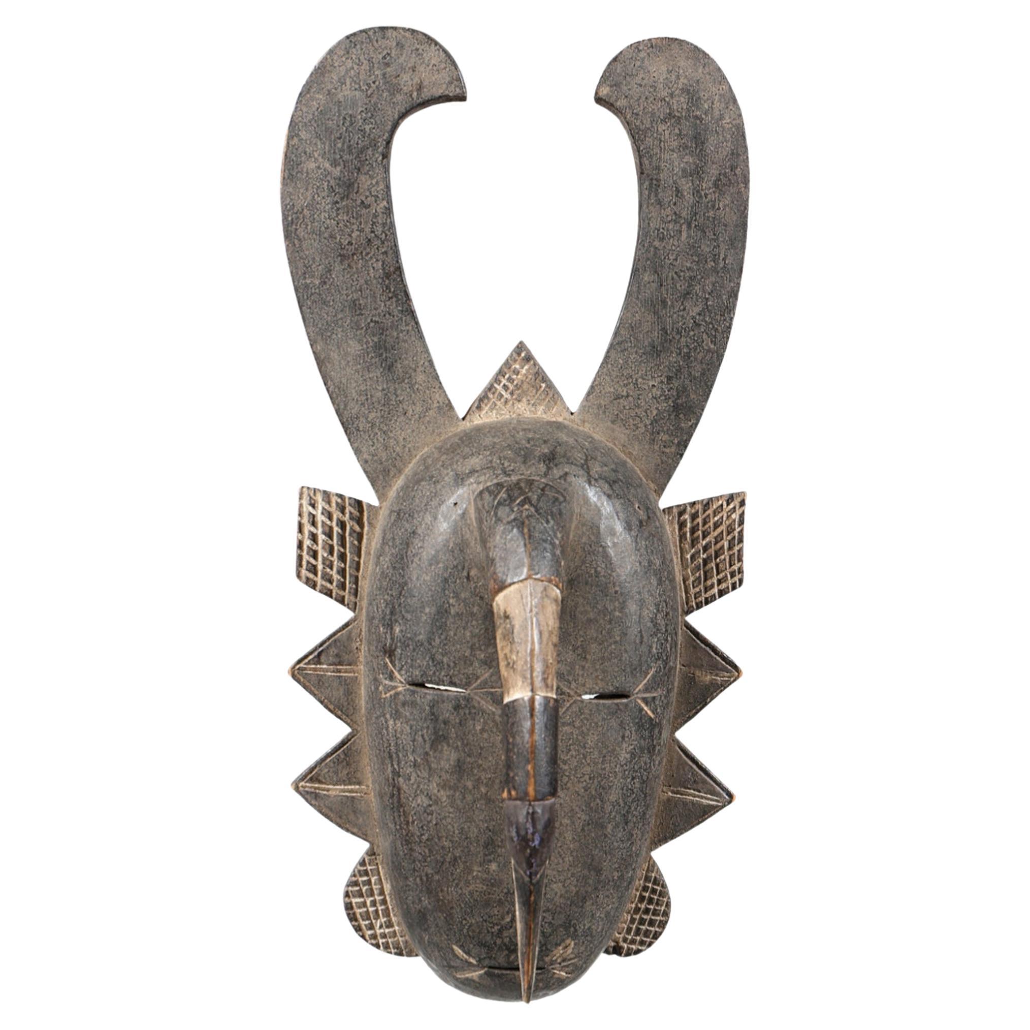 Antique Baule Tribal Horned Mask from Ivory Coast, Hand-Carved African Wood Art For Sale