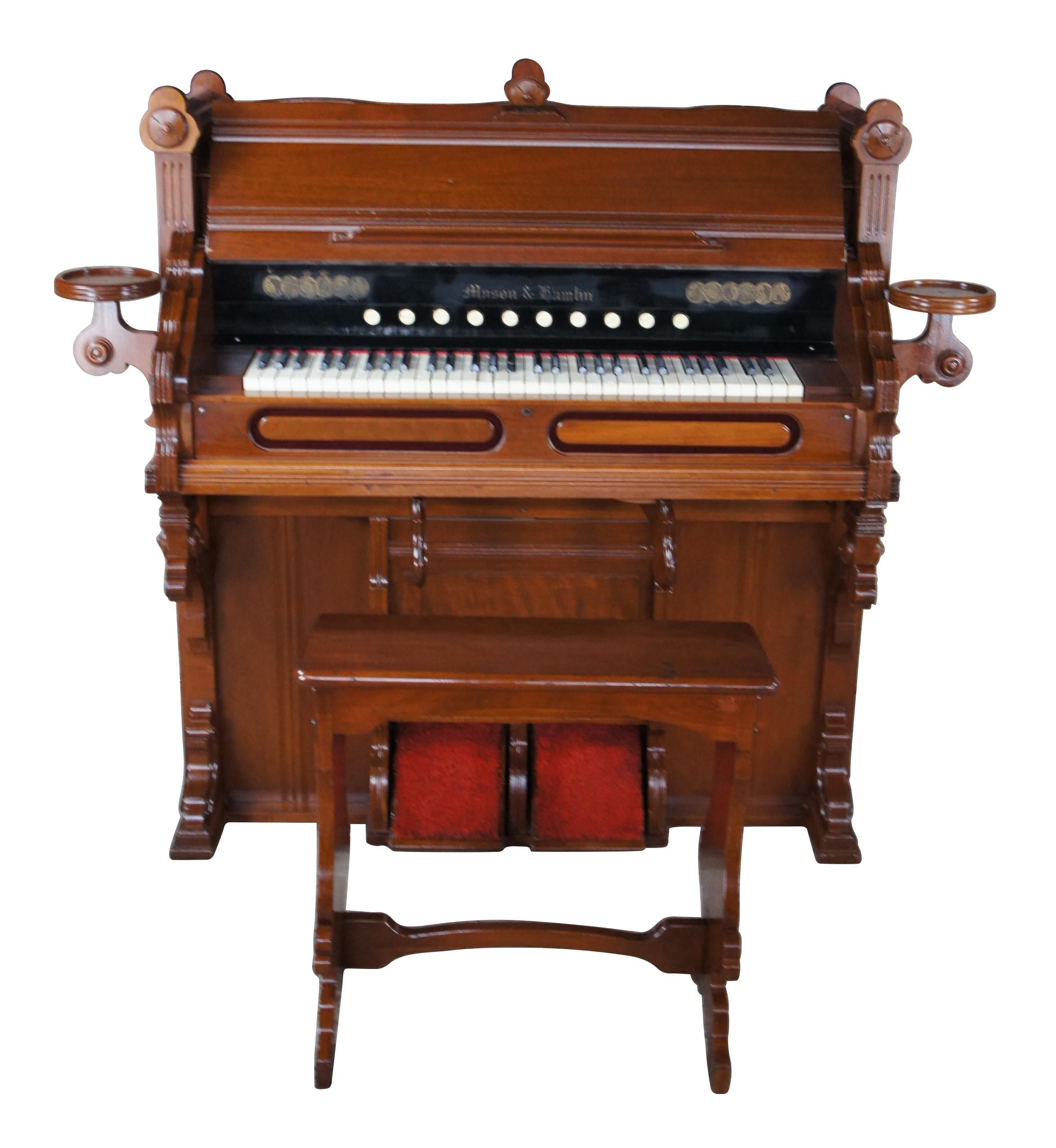 This reed organ was made by Mason & Hamlin in Boston, Massachusetts, cirfca 1890s. It is a parlor / Chapel model with a with a single keyboard, two knee swells, and two pedals.  Made from walnut with burled and carved accents.  Neatly flanked by