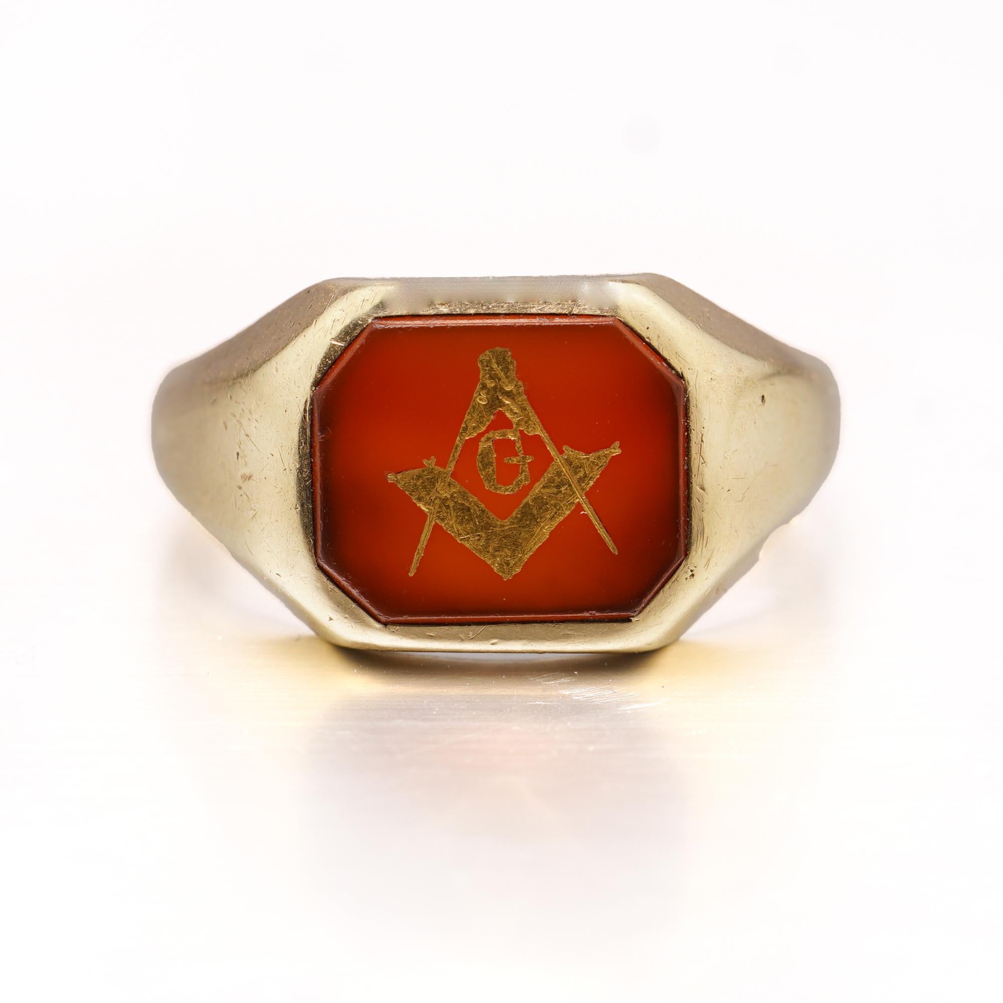 Antique Masonic 14kt. yellow gold and enamel ring, depicting Square and Compass.
Made in the United States, Ca. 1920's 
Hallmarked for 14kt. yellow gold. 

While there are many symbols associated with Freemasonry, none are more universally