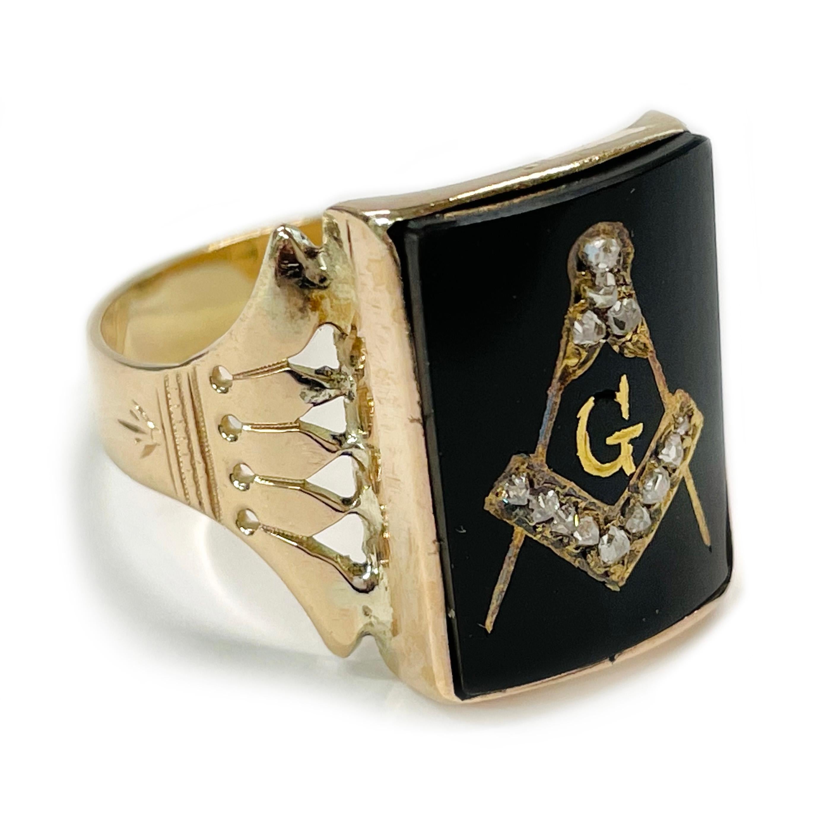 14 Karat Antique Masonic Yellow Gold Diamond Onyx Ring. This fantastic ring features a 18 x 13.3mm rectangular curved onyx stone with a carved and then gold gilded masonic logo and thirteen rough cut diamonds. The band has milgrain and diamond-cut