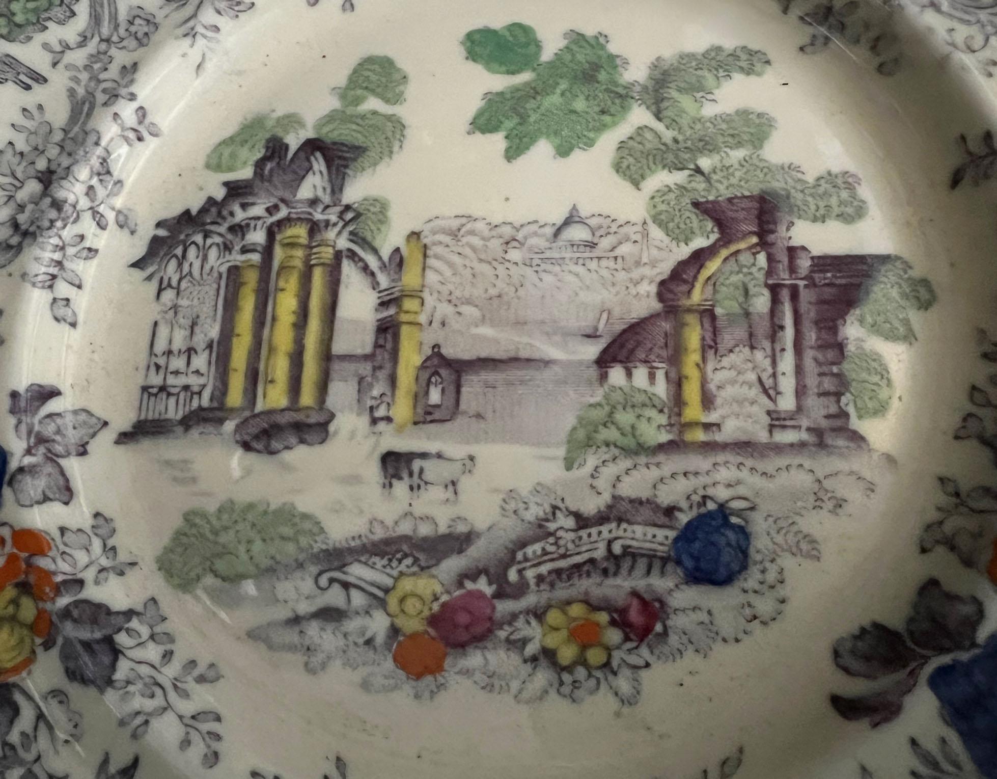 A beautifully hand painted Edwardian era Mason's Ironstone plate with columns and florals. England, circa 1900s.