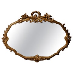 Antique Massive French Giltwood Mirror with Floral Crest