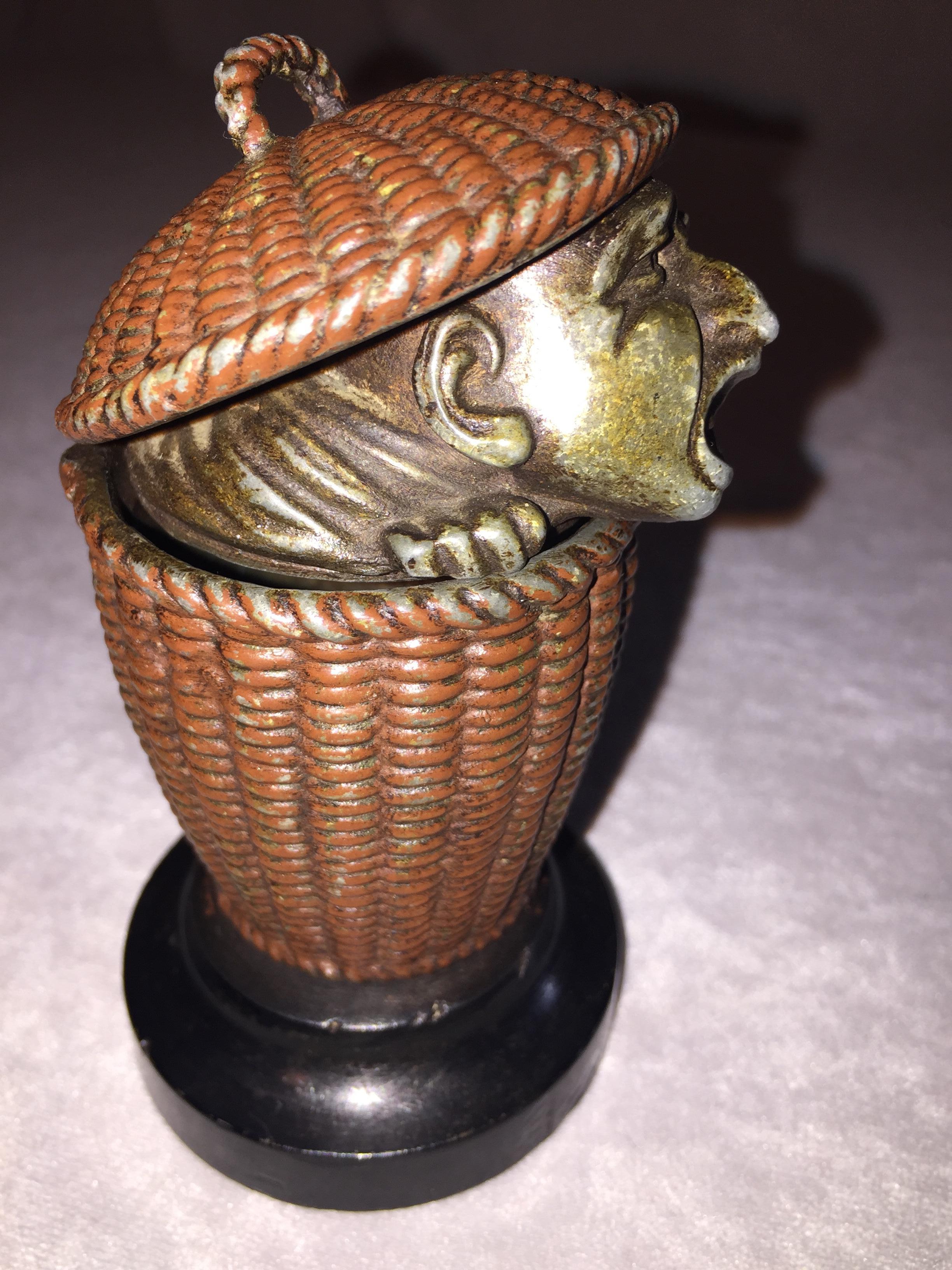 American Antique Match Safe with Man Peeking Out of a Basket