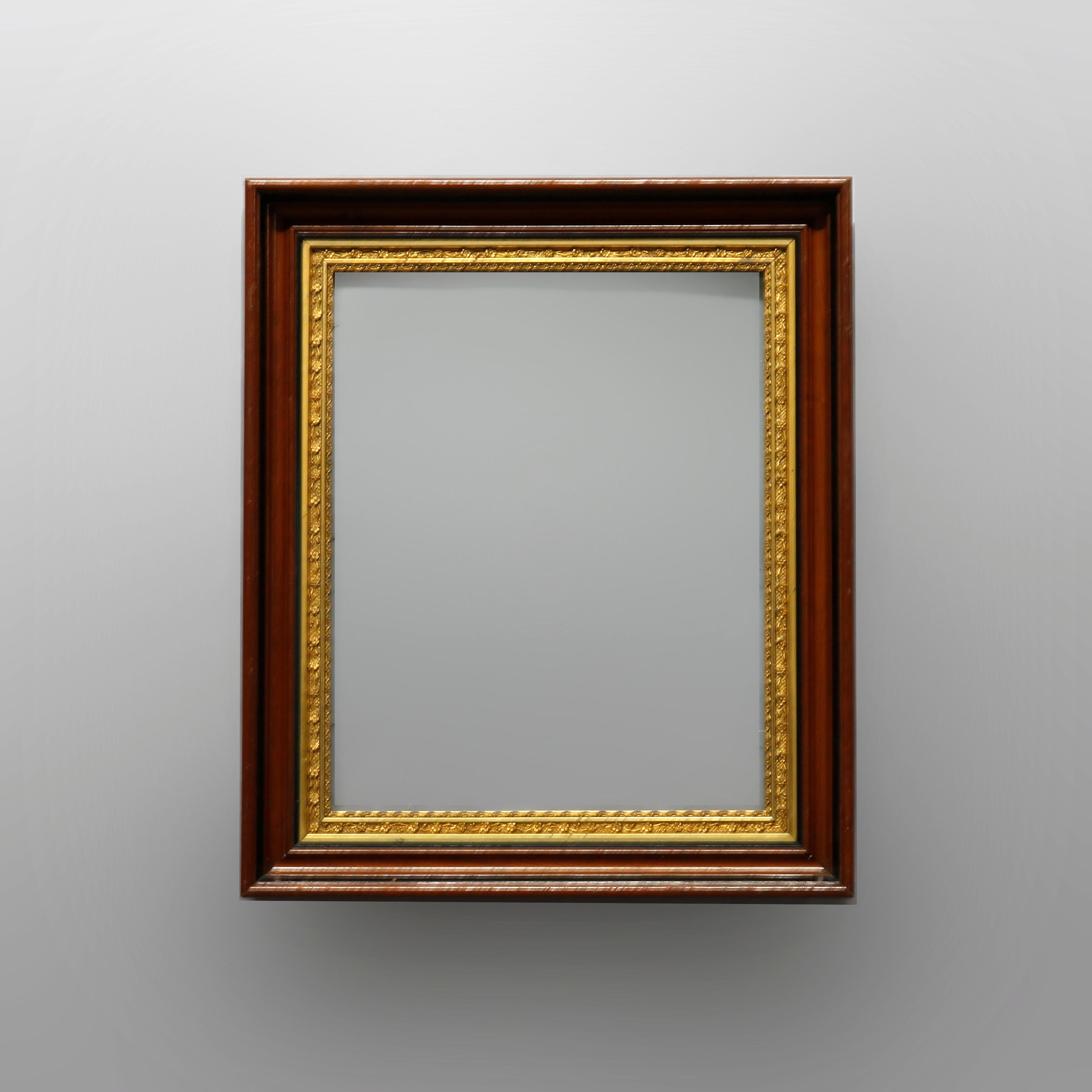 An antique matching pair of art frames offer walnut construction with floral and foliate relief giltwood interior trimming with ebonized banding, c1890

Measures: overall 25.75