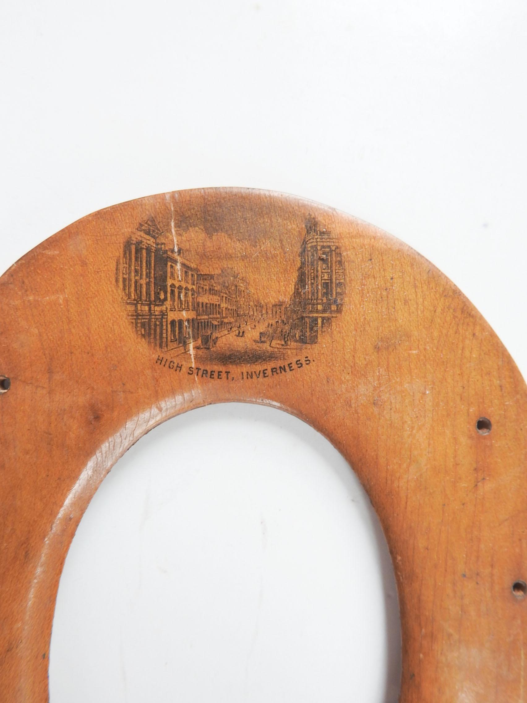 Antique circa 1890's Mauchline or treenware souvenir picture frame. Carved in the shape of a horseshoe with a lithographed pictue of High Street, Inverness Scotland. Very popular with Victorian travelers, opening size 2