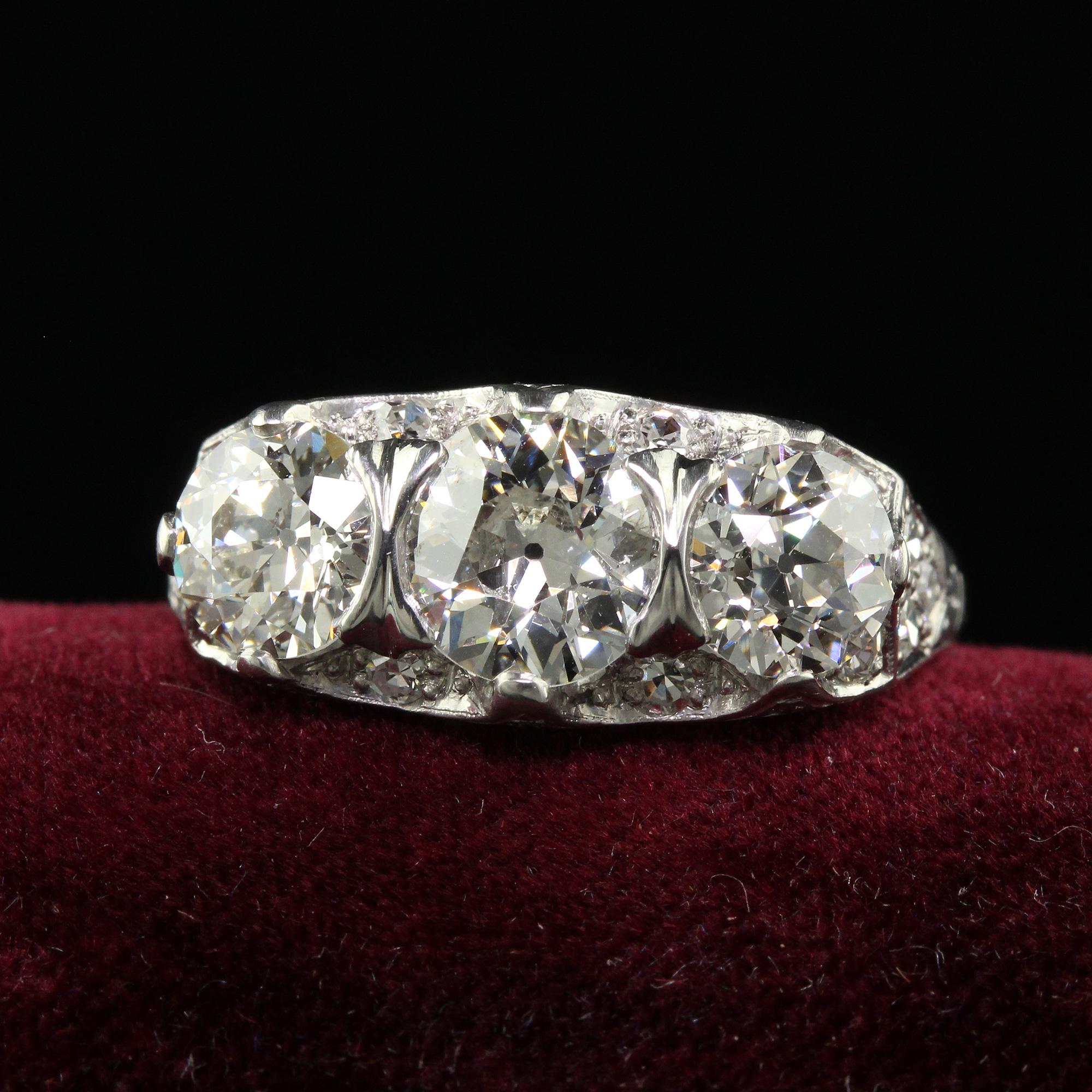 Beautiful Antique Maurice Tishman Art Deco Platinum Old Euro Three Stone Filigree Ring GIA. This incredible Art Deco Maurice Tishman old European diamond three stone ring is crafted in platinum. This amazing ring holds three old European cut