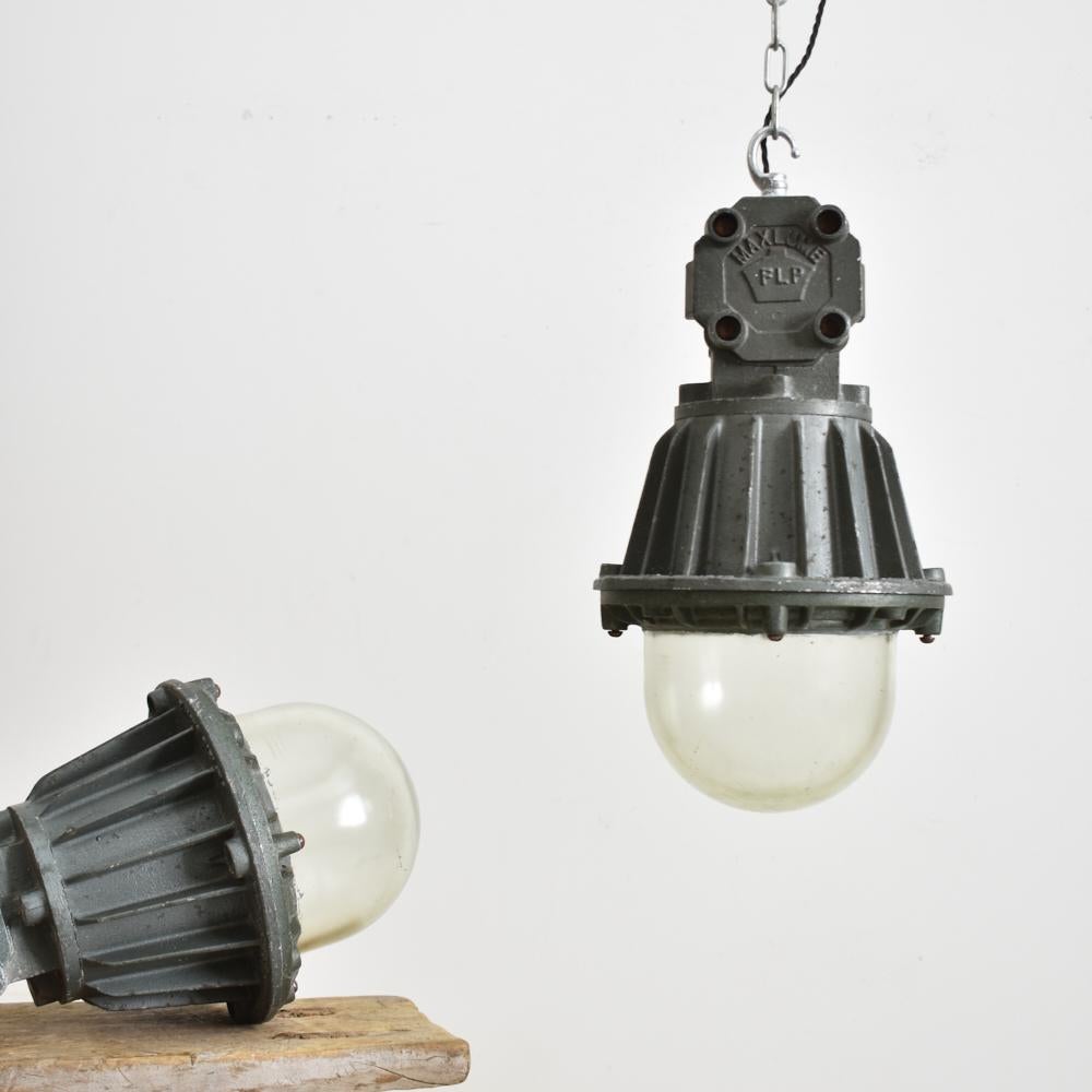 Antique Maxlume industrial pendant light.

An original heavy cast steel light manufactured by ‘Maxlume’.The light was used in a chemical factory and consists of flameproof glass and components to ensure illumination in all conditions. The cast