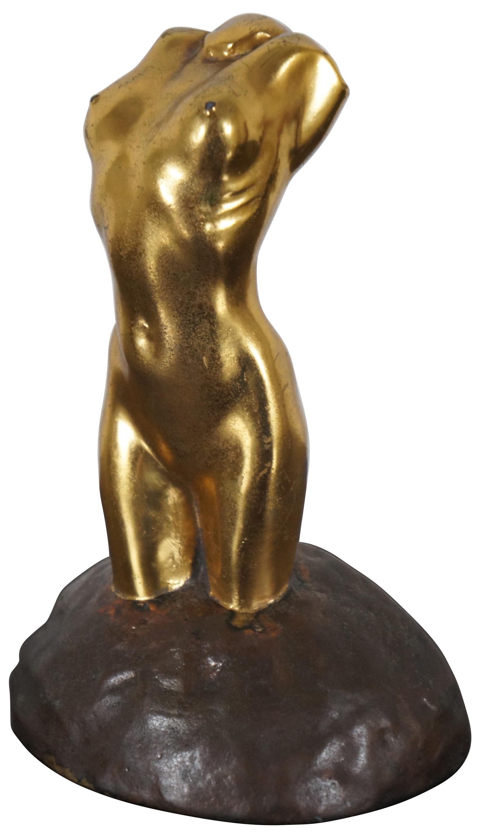 Antique McClelland Barclay bronze figurine in the shape of a neoclassically inspired female figure without arms or head, embedded in a half round base and gilded in bright gold.
      