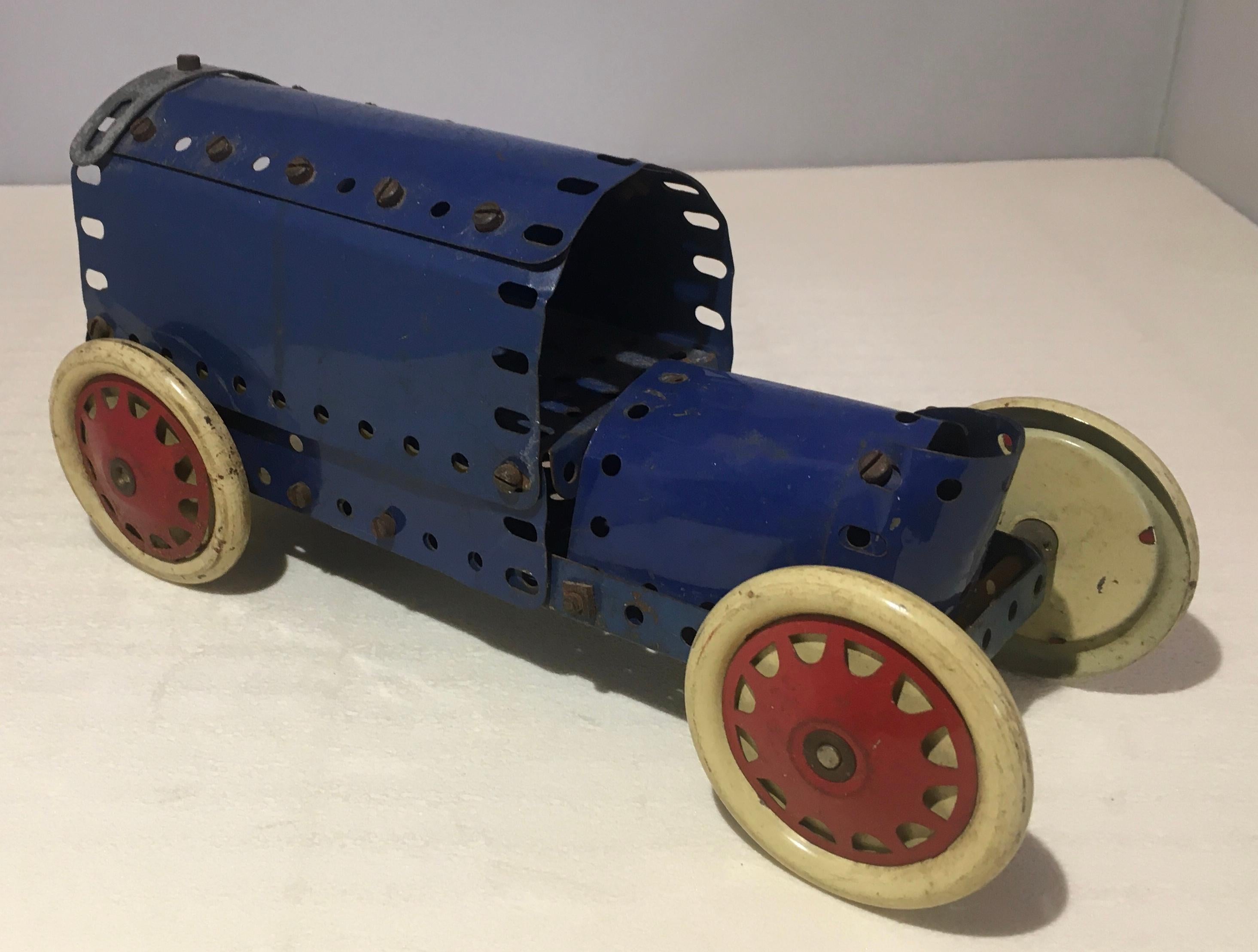 Great collectible. Meccano, this great system of construction, born at the beginning of the 20th century.

Toy store display, circa 1927. This is a very cool and rare Meccano constructed automobile with a distinct Brass Era aesthetic. 

Measures: 10