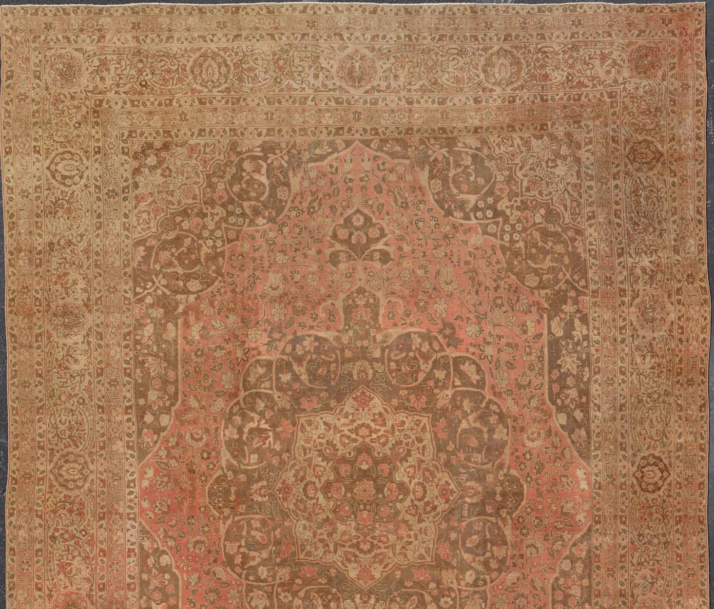 Antique Medallion Tabriz Carpet in Pink, Light Brown, Camel, Taupe, and Salmon. Keivan Woven Arts / rug E-0303, country of origin / type: Iran /Tabriz, circa 1890.
Measures: 12'10 x 17'9.
This magnificent antique Tabriz carpet beautifully