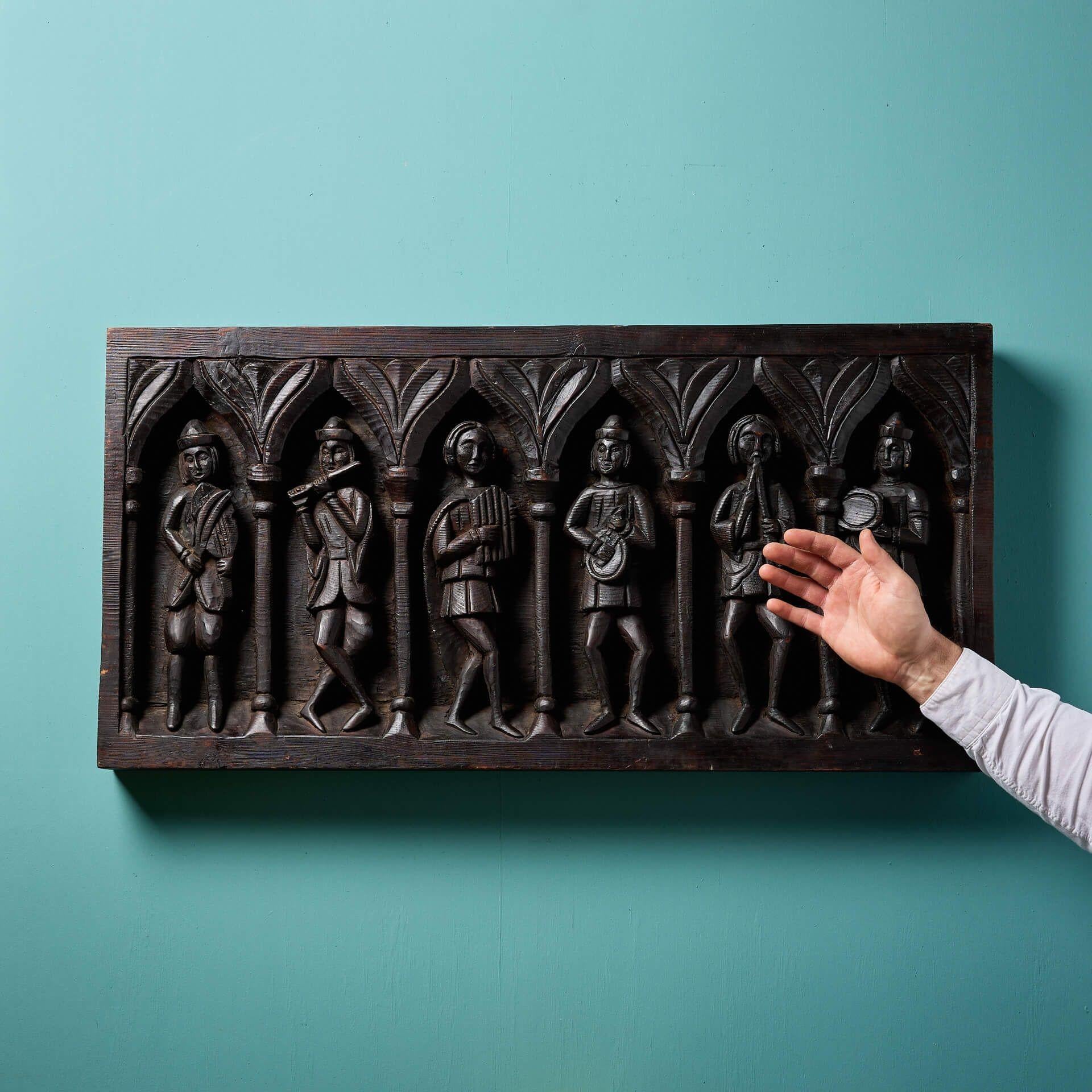 An impressive antique early medieval carved pine panel, originating from England's 19th century north country.

Dating to circa 1900, this handsome decorative wall hanging is handcarved in relief in a naive early English medieval style with carved a