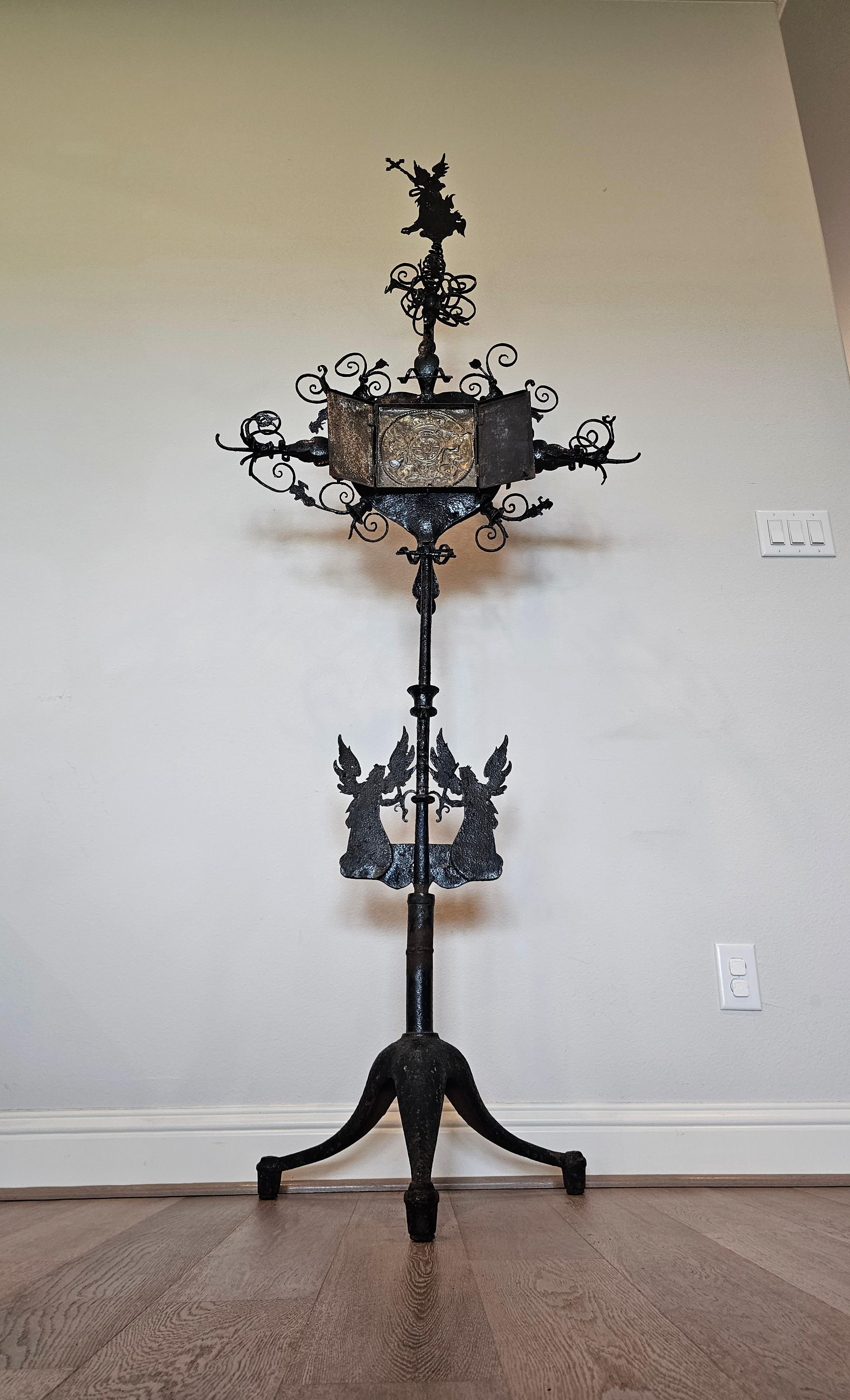 A spectacular early European castle altar processional / torchiere stand. circa 1730 or earlier. 

Born in Continental Europe in the early 18th century or earlier, some later elements, most likely Germanic, Medieval Gothic style, hand forged iron