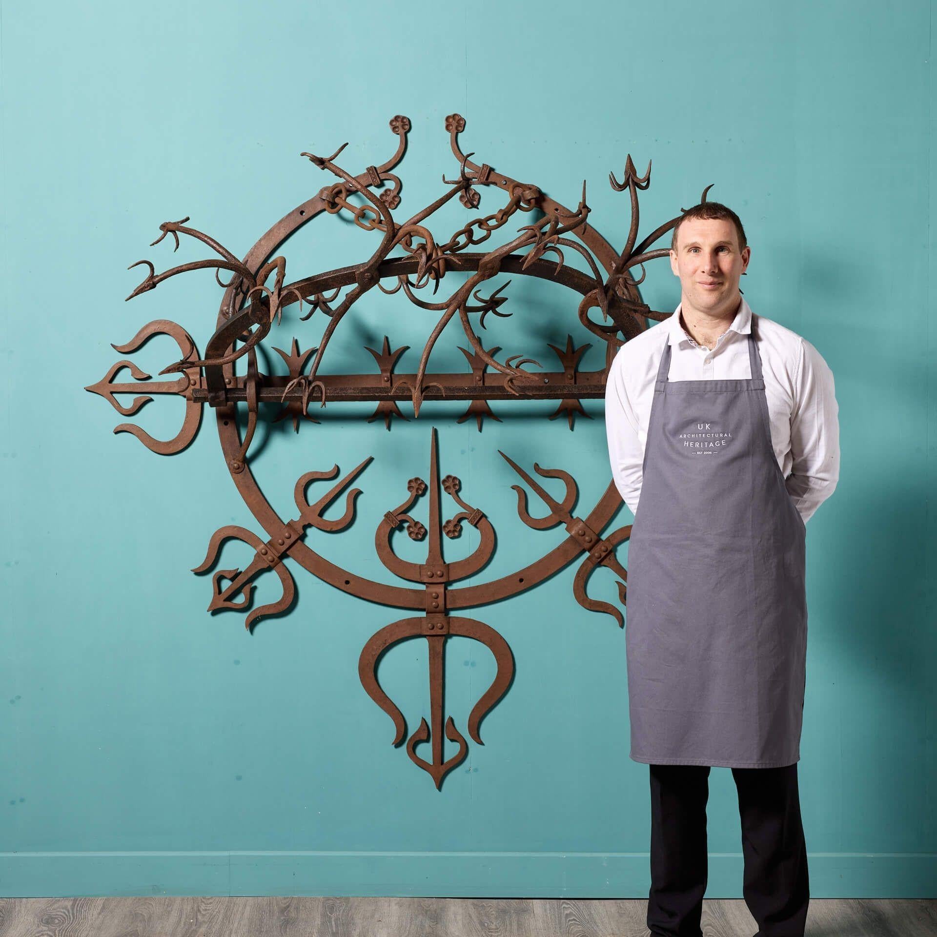 An antique early 18th century wrought iron gate guard. Believed to originate from a Scottish castle, this large unusual gate guard’s striking spikes give a menacing, medieval look, while displaying detail and precision; a masterclass in 18th century