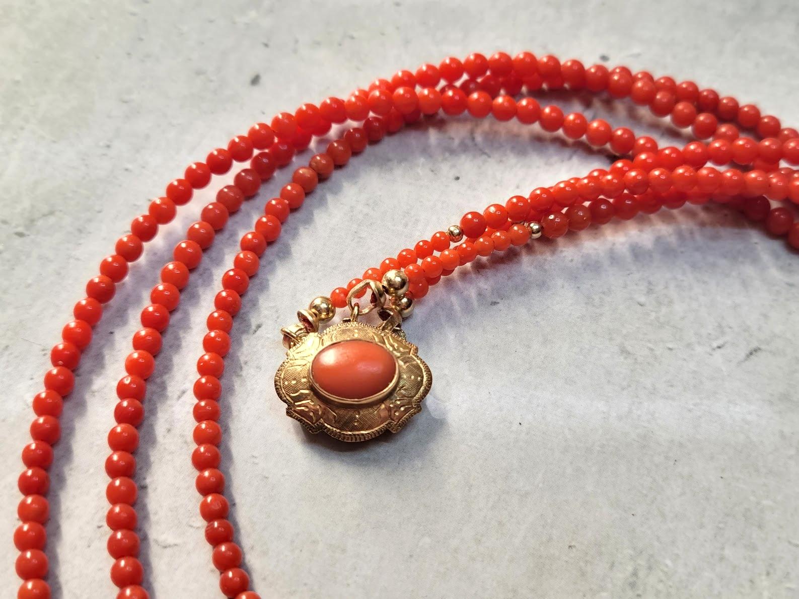 A 3-strand antique coral necklace very exceptional necklace.
The length of the necklace is 18.5 inches (47 cm).
The size of the round, smooth tiny coral beads is 3.2mm. The size of small coral beads around the clasp is 2mm. The size 14k gold beads