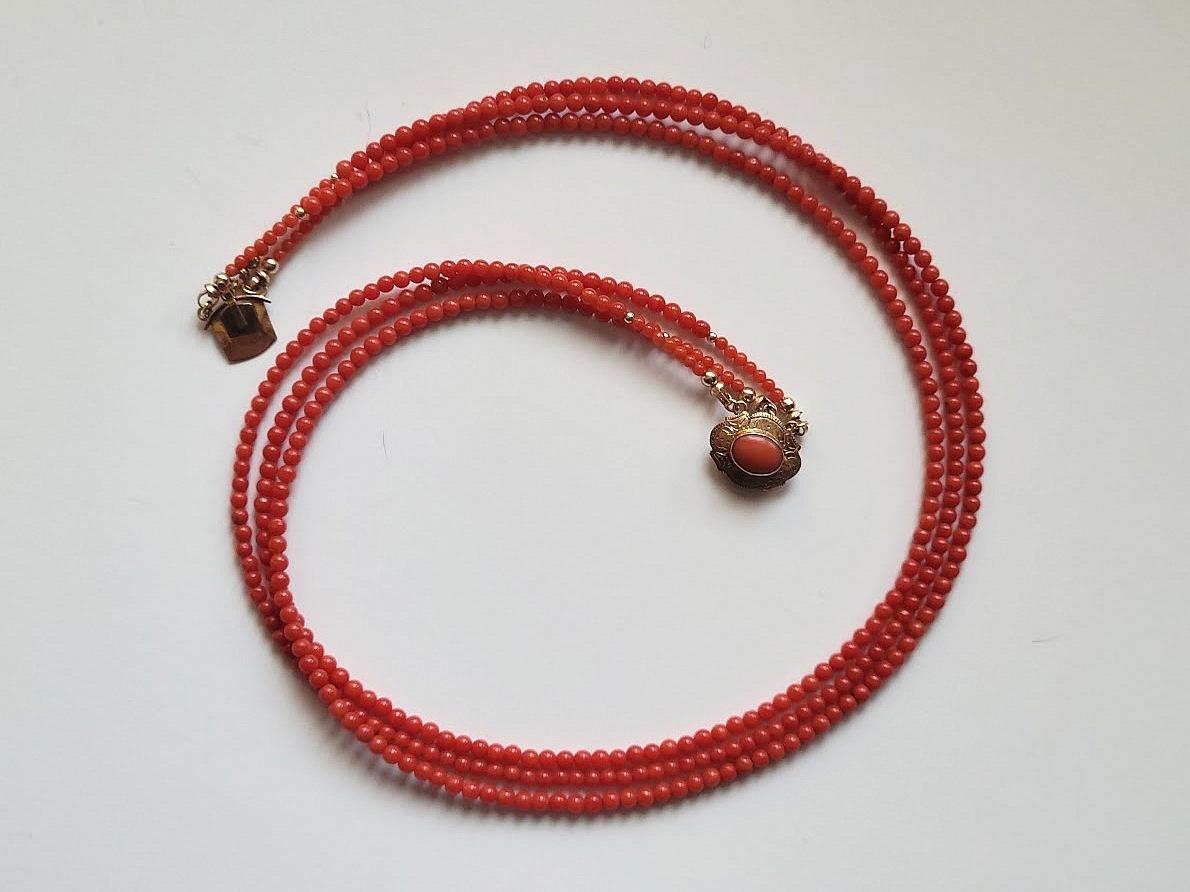 A 3-strand antique coral necklace, a very exceptional necklace.
The length of the necklace is 18.5 inches (47 cm).
The size of the round, smooth, tiny coral beads is 3.2mm. The size of small coral beads around the clasp is 2mm. The size 14k gold