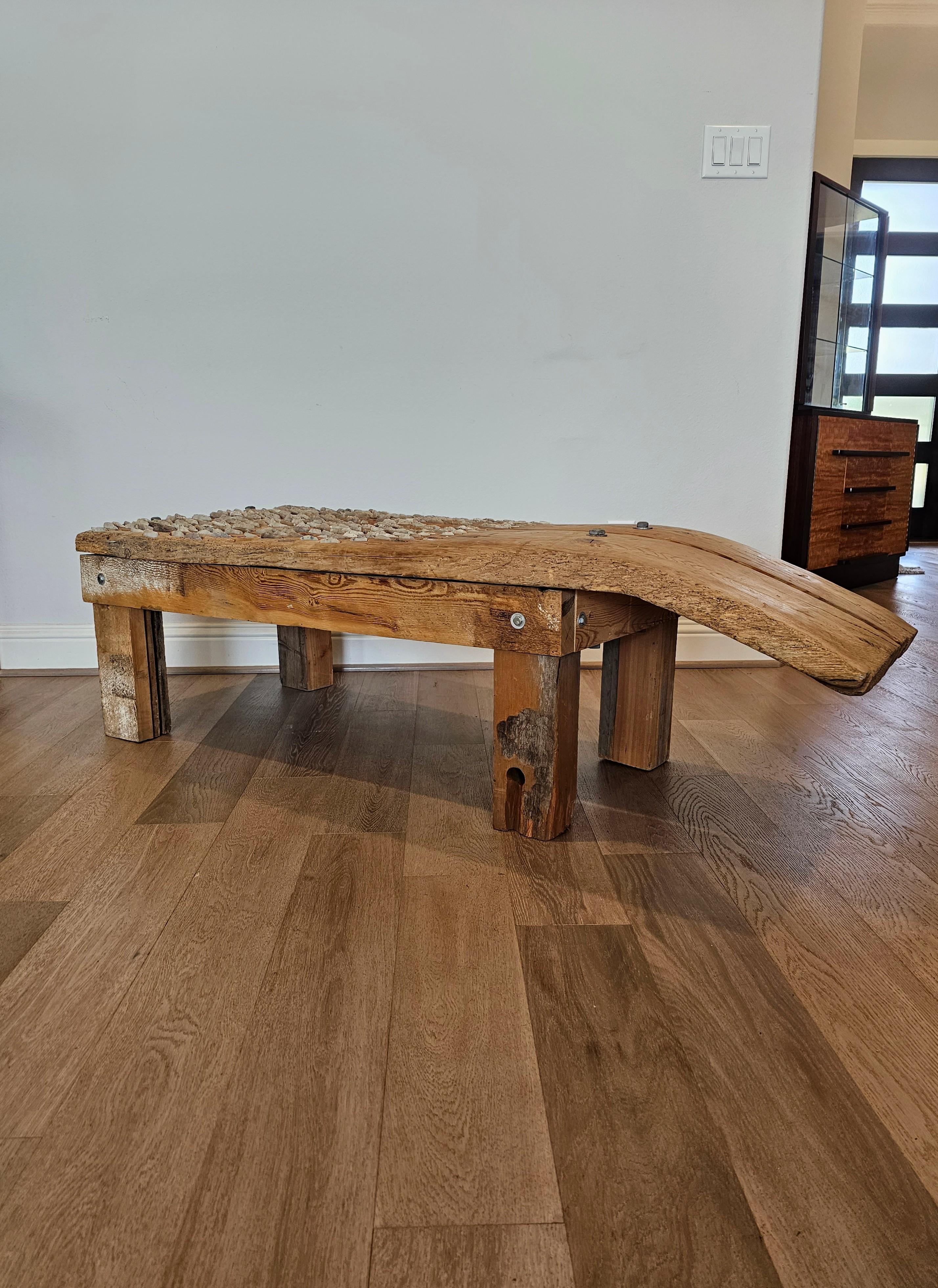 A most impressive antique Mediterranean threshing board repurposed as a bench or coffee table. 

This 19th century thresing board, also known as threshing sledge or tribulum, was a primitive agricultural implement - farm tool used to separate