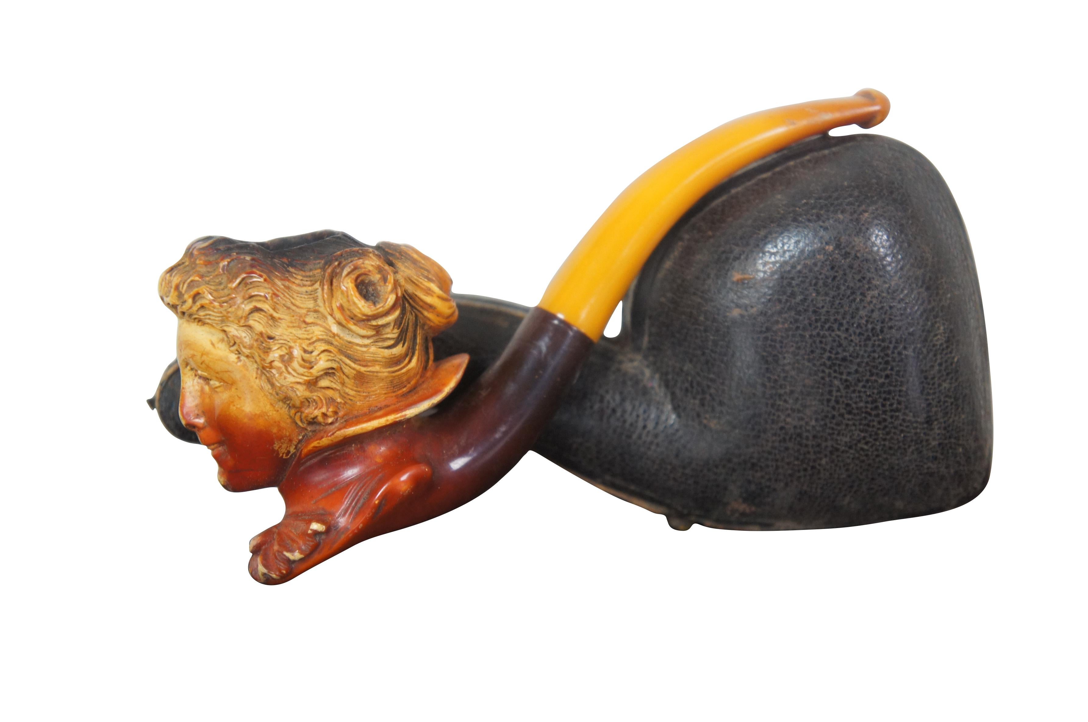Antique carved meerschaum pipe with amber Bakelite stem. Features a bust of what appears to be young Queen Victoria.
  