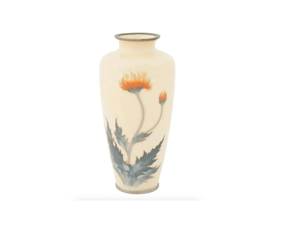 A rare elegant Japanese vase cast of metal, possibly brass, featuring a baluster shaped body and a wide short neck. The surface is decorated with a delicate image of a thistle flower and bus on a pale yellow ground. Unmarked. Meiji era, 1868 to
