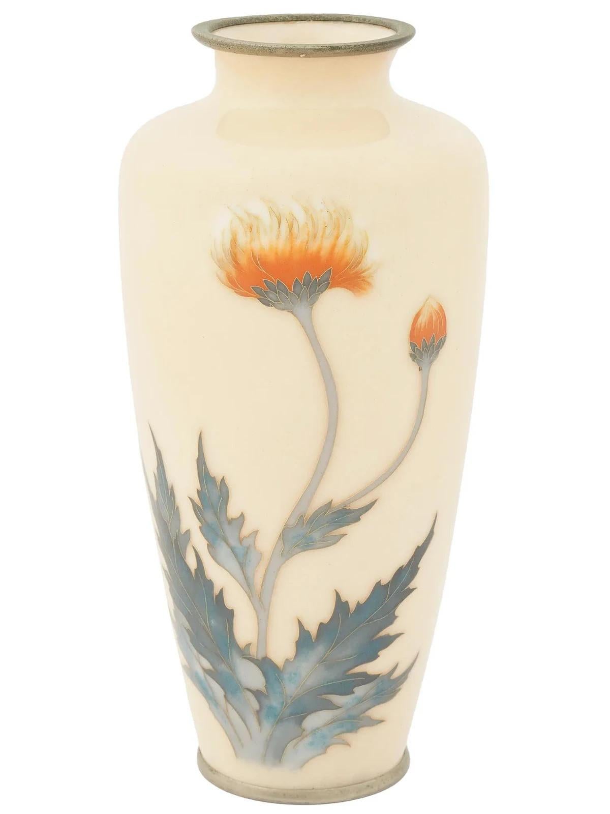 A rare elegant Japanese vase cast of metal, possibly brass, featuring a baluster shaped body and a wide short neck. The surface is decorated with a delicate image of a  thistle flower and bus on a pale yellow ground. Unmarked. Meiji era, 1868 to