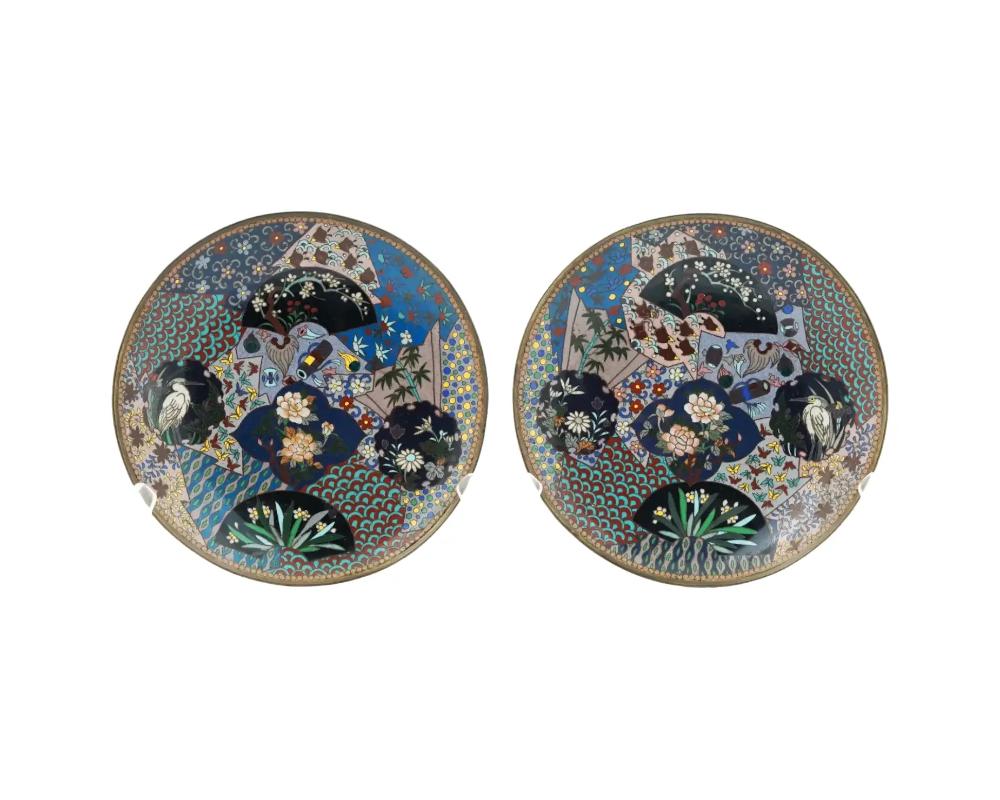 Pair of Antique Meiji Japanese Cloisonne Plates Geometric Patterns Floral Sprays Cranes



A pair of matched antique Japanese cloisonne enamel plates decorated with various multicolored panels depicting cranes, highly detailed floral compositions