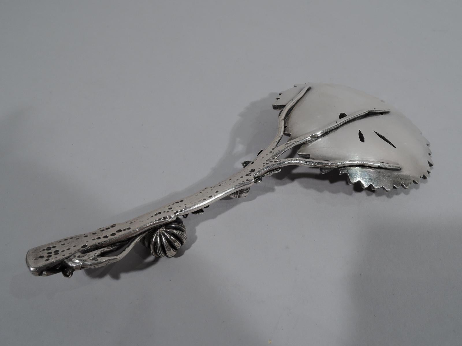 Meiji-era silver Chrysanthemum serving spoon, circa 1880. Round flower head bowl with overlapping, pell-mell petals. Stem handle with applied buds and leaves. Modish Japanese Japonisme. Marked with Japanese characters and K&K stamp. Weight: 3 troy