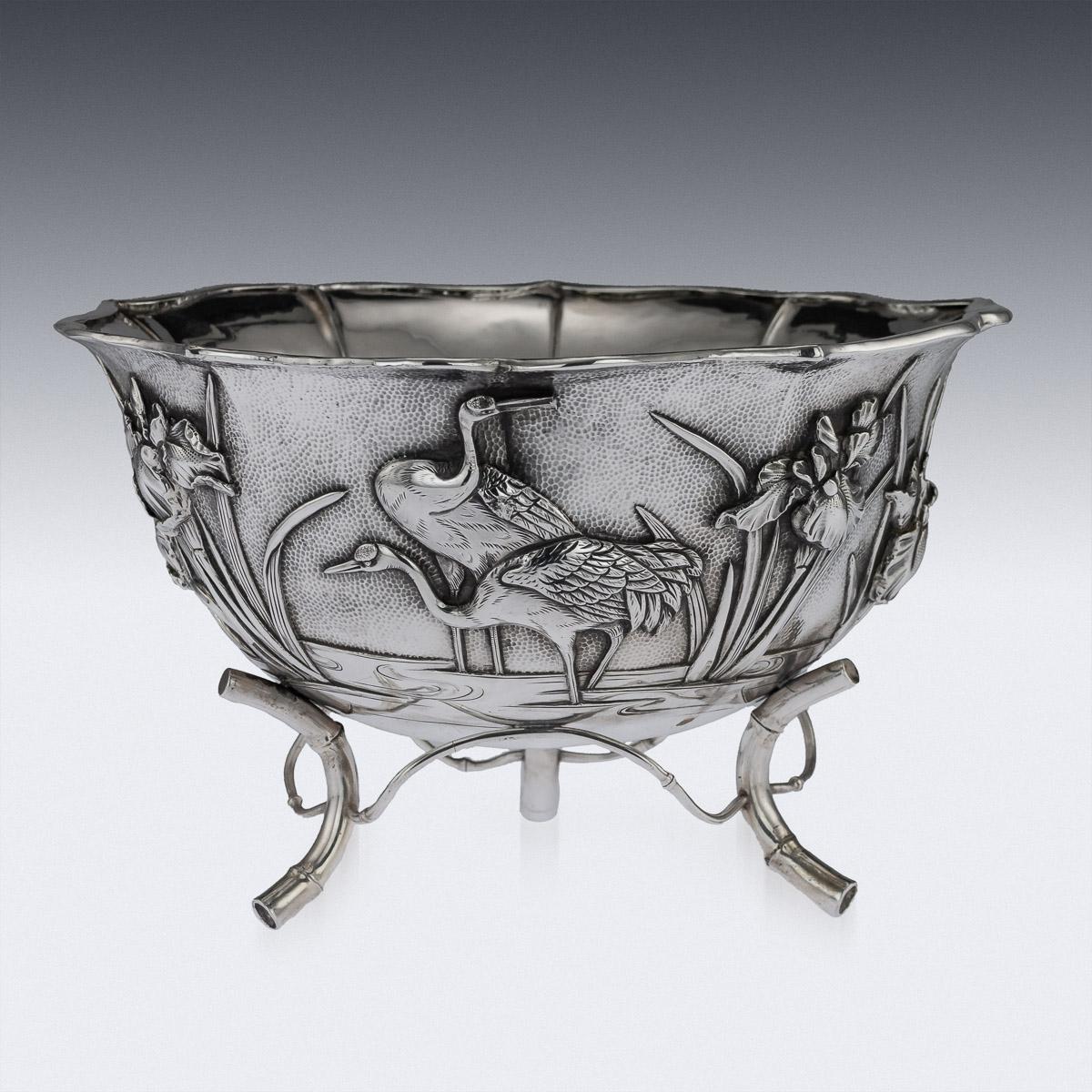Antique early 20th century Japanese Meiji period solid silver bowl, double walled, chased and embossed with blossoming irises and cranes in high relief on matted ground, shaped floral rim applied with a pronounced boarder and standing on three