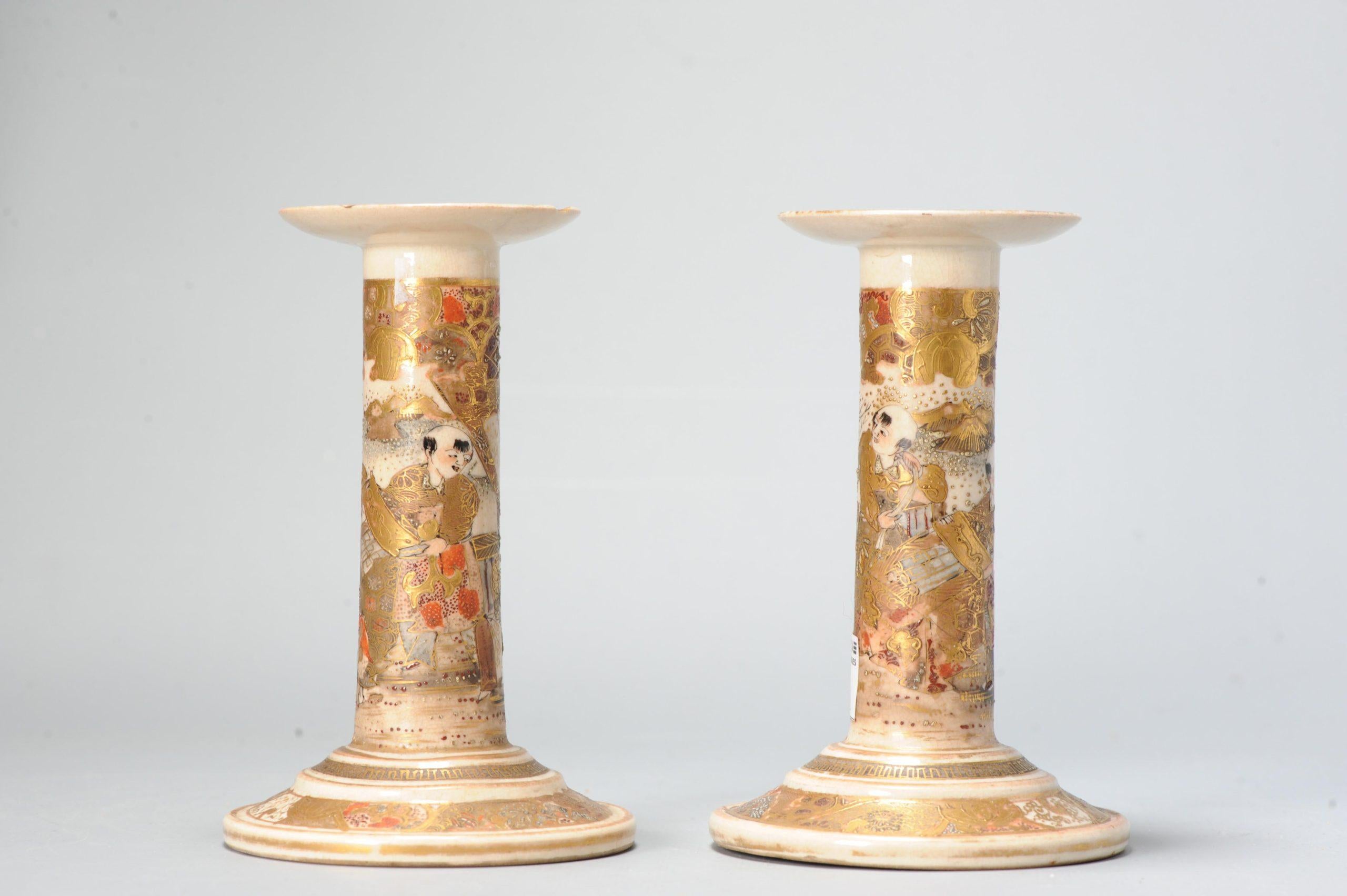 Fabulous Japanese earthenware Satsuma candle sticks with nice decoration of flowers and figures decoration marked. Meiji period, 19th century

Lovely piece.

Marked base:


Condition: 1 candle stick with 3 chips to upper rim. Size: 140mm