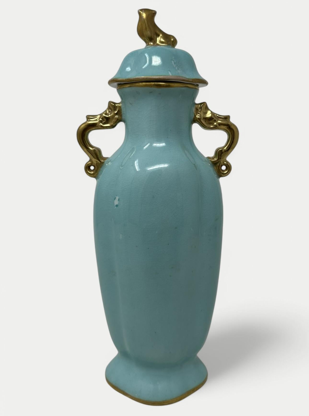Fine German Hard Paste Turquoise Green Blue Dresden Porcelain Tall Ovoid formed Mantle or Desk Vases, late Nineteenth early Twentieth Century. 

Complete with its original dome shaped cover with Chinese Foo Dog finial. The gilt twin handles modelled