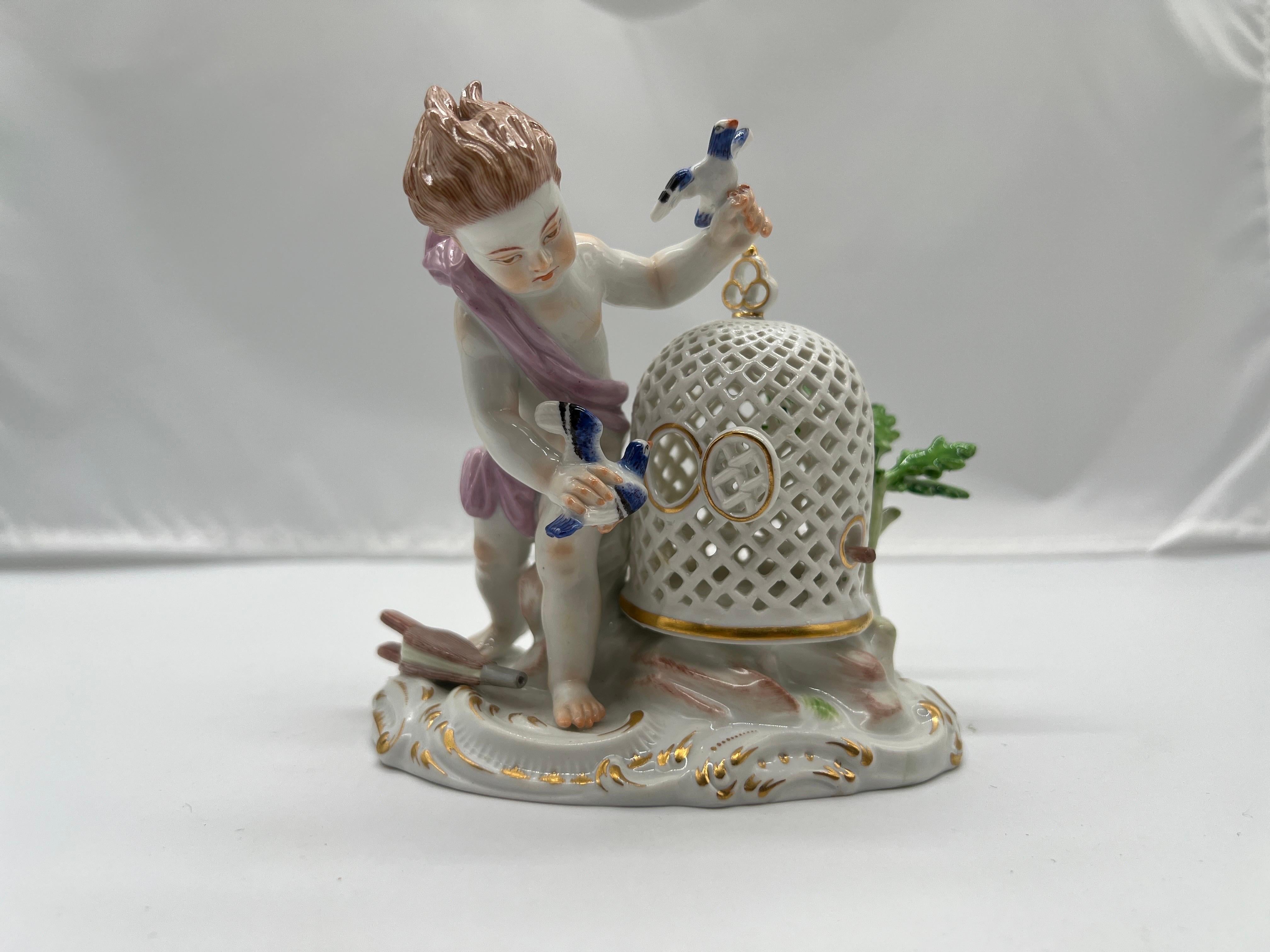 Meissen, 19th century.

A fine quality Meissen porcelain figurine depicting a young boy playing with his pet bird. The figure stands next to a pierced porcelain bird cage adorned with foliage. Marked to underside with appropriate underglaze. 