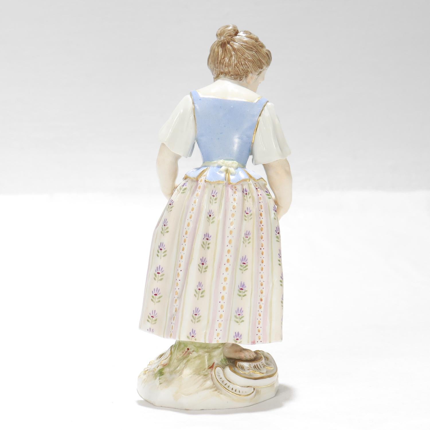 Antique Meissen Porcelain Figurine of a Girl with Flower Basket In Good Condition For Sale In Philadelphia, PA