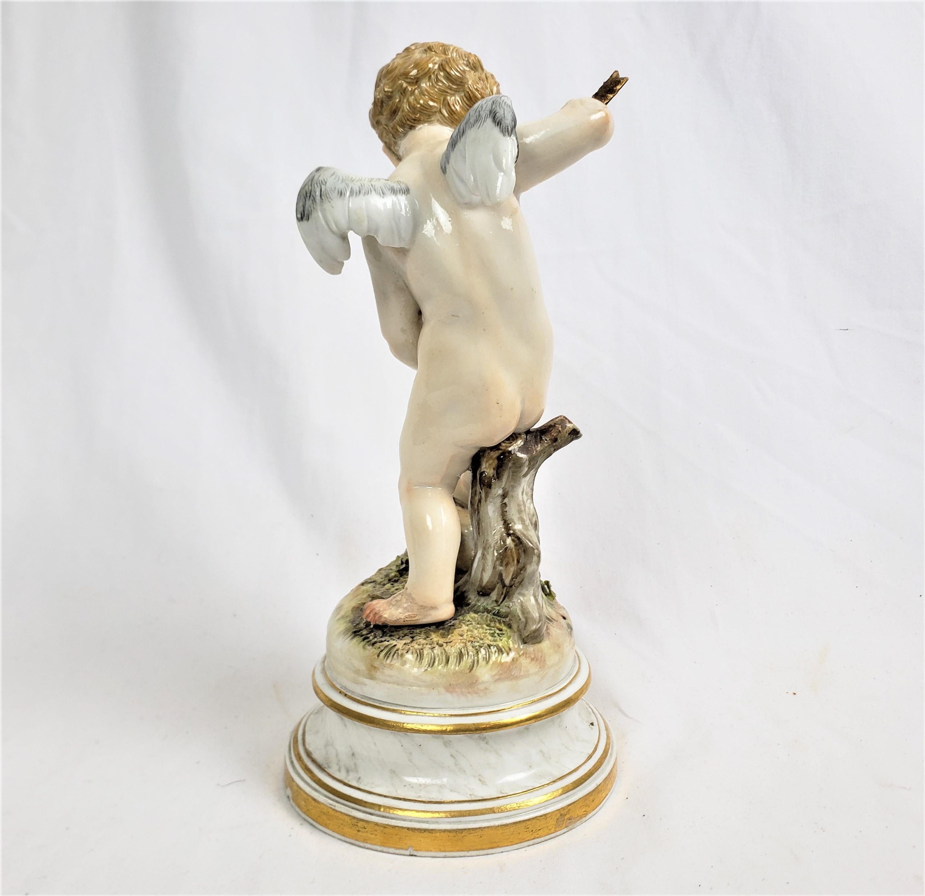 Romantic Antique Meissen Porcelain Figurine of Cupid Holding an Arrow & Flaming Heart For Sale