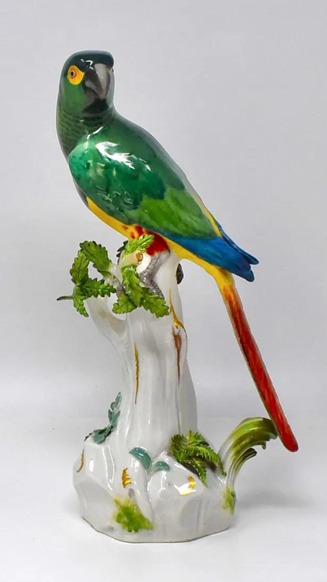 Antique (late 19th century) Meissen polychrome glazed porcelain parrot measuring approximately 12 inches tall and in very good condition. Underside with the familiar blue underglaze mark of crossed swords, plus hand-incised mark of the original