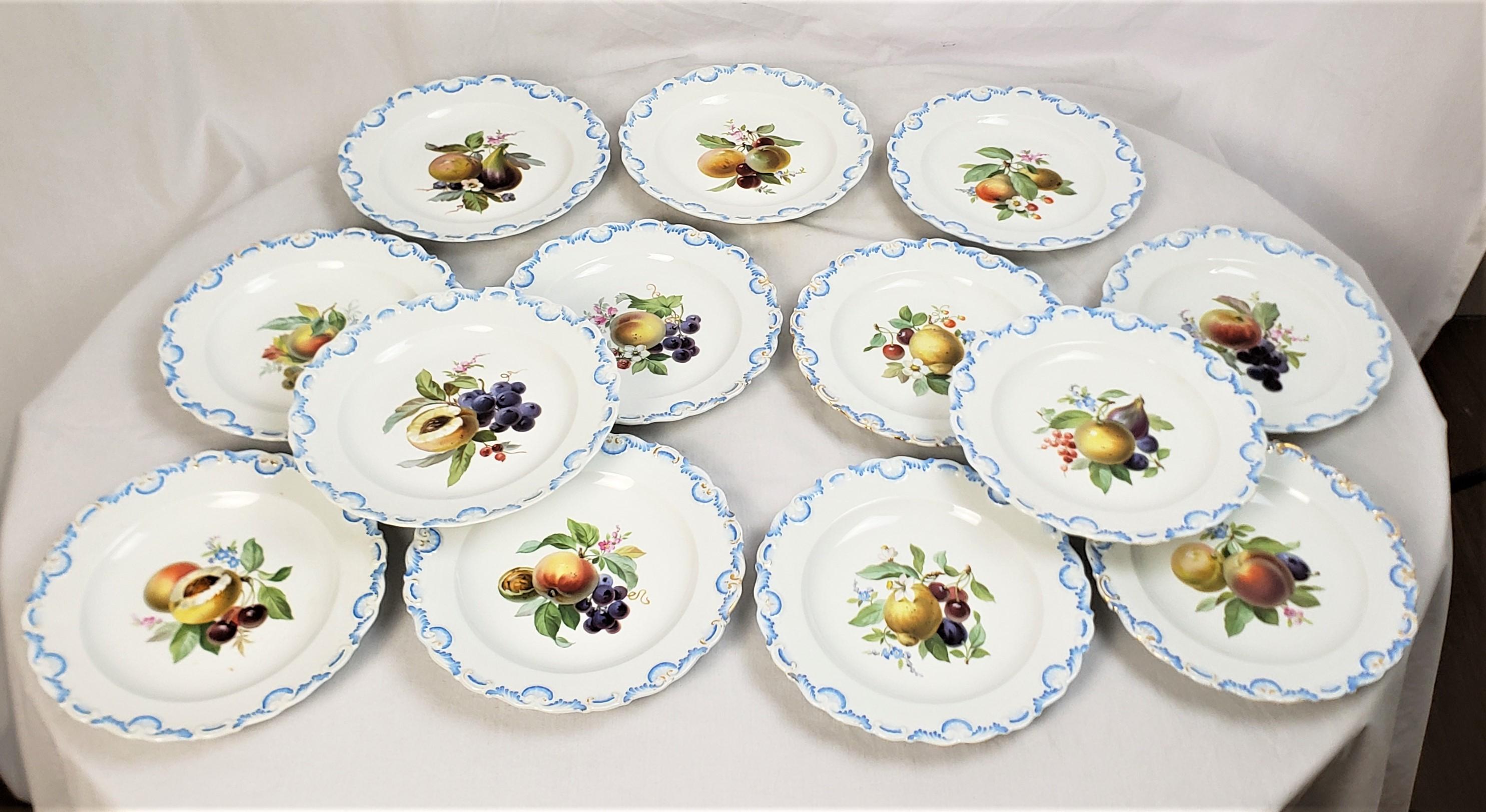 This set of antique desert or side plates was made by the renowned Meissen factory of Germany in approximately 1880 in a period Victorian style. The plates are composed of porcelain with a raised border with light blue and gilt accents and each
