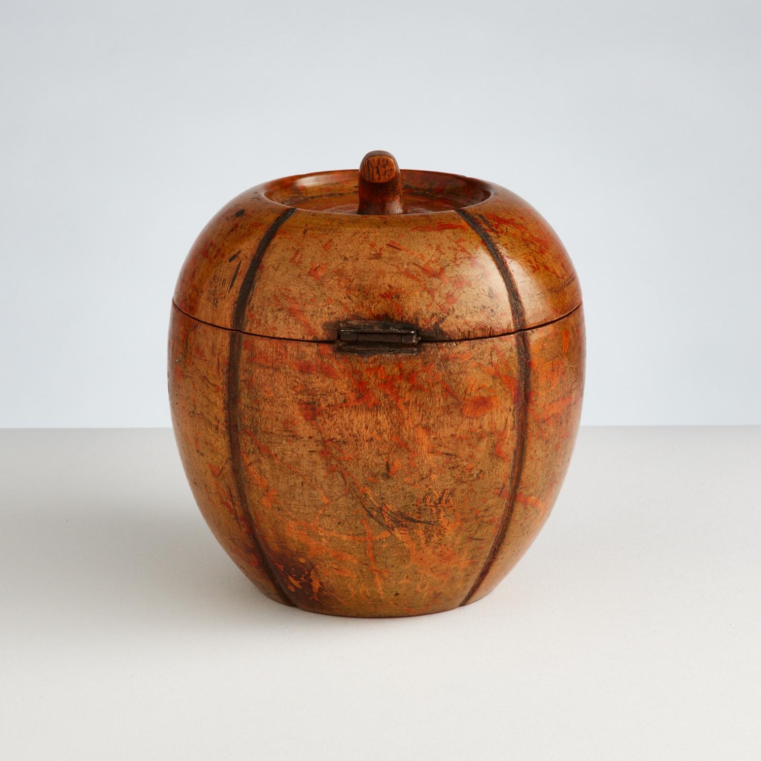 Antique Melon fruit wood Tea Caddy Date 1790-1800
Origin English

This Early fruit wood tea Caddy is in excellent condition and it has the most beautiful original patina.
The hinge and front small front escutcheon are in good order and the interior