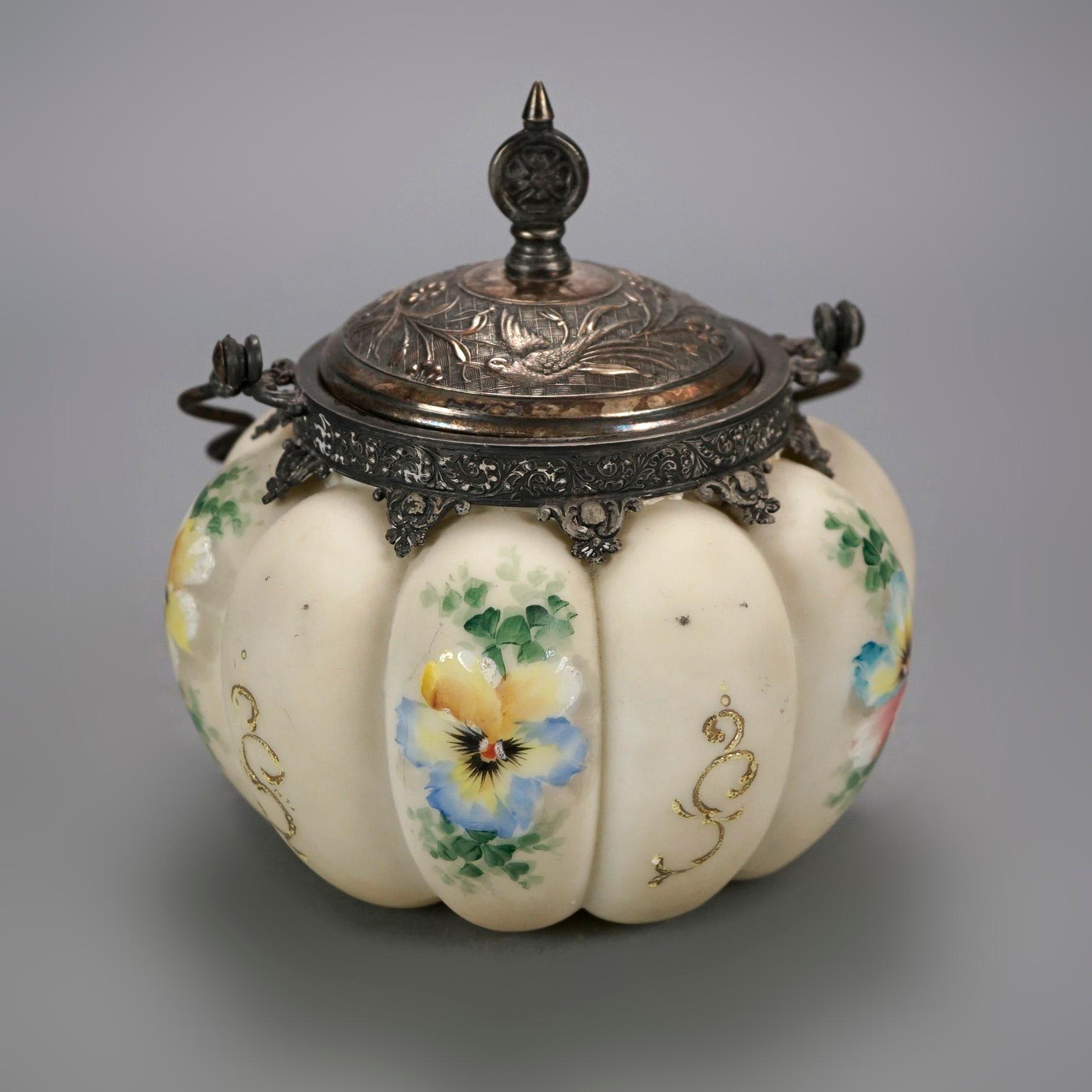 An antique melon biscuit jar offers melon ribbed form with hand painted floral elements and silver plate lid with handle, c1890

Measures- 7.25'' H x 6.5'' W x 7.25'' D.