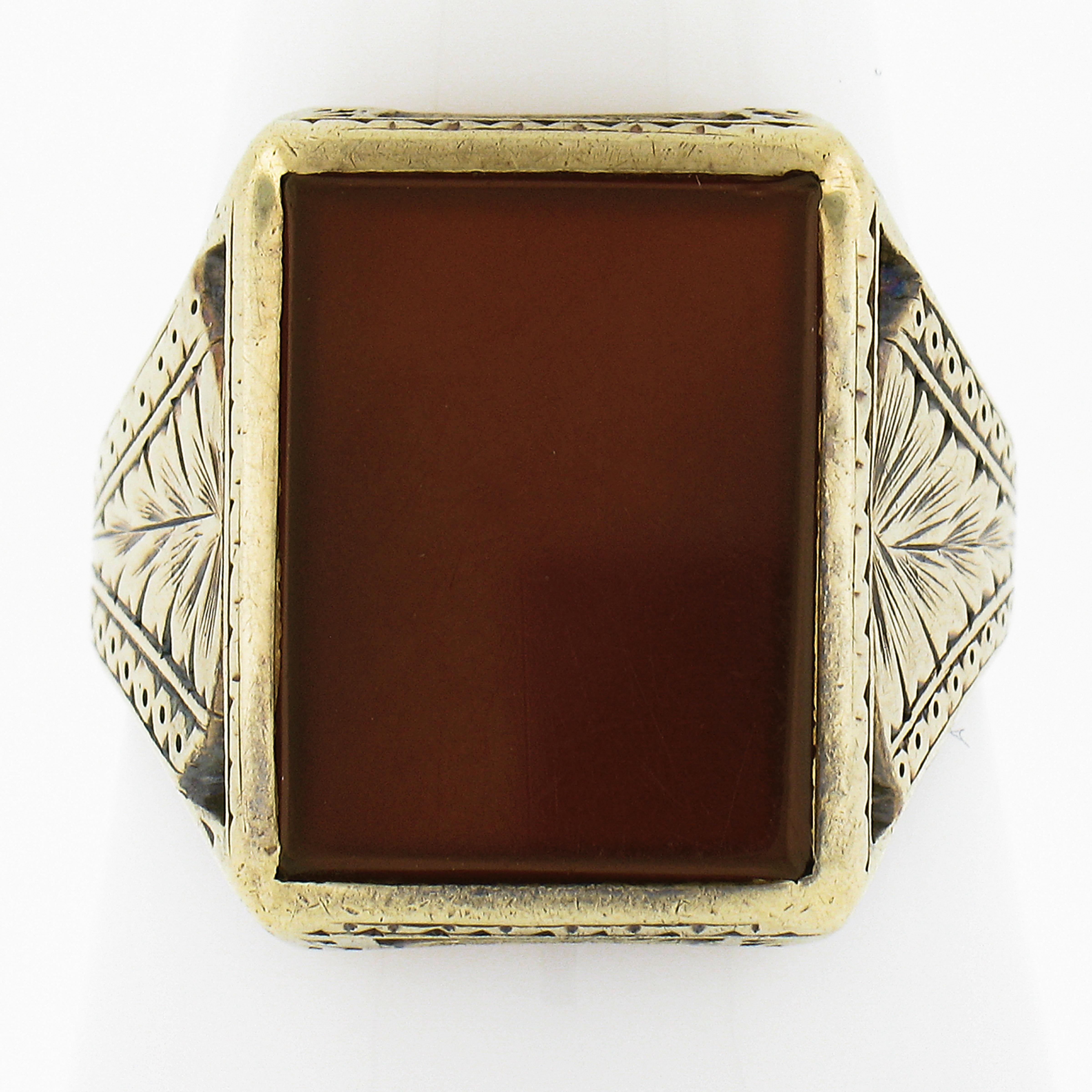 --Stone(s):--
(1) Natural Genuine Carnelian - Rectangular Cut - Bezel Set - Rich Brownish Orange Color - 15x11.3mm (approx.)

Material: 14K Solid Yellow Gold
Weight: 7.13 Grams
Ring Size: 10.0 (Fitted on a finger. We can custom size this ring -