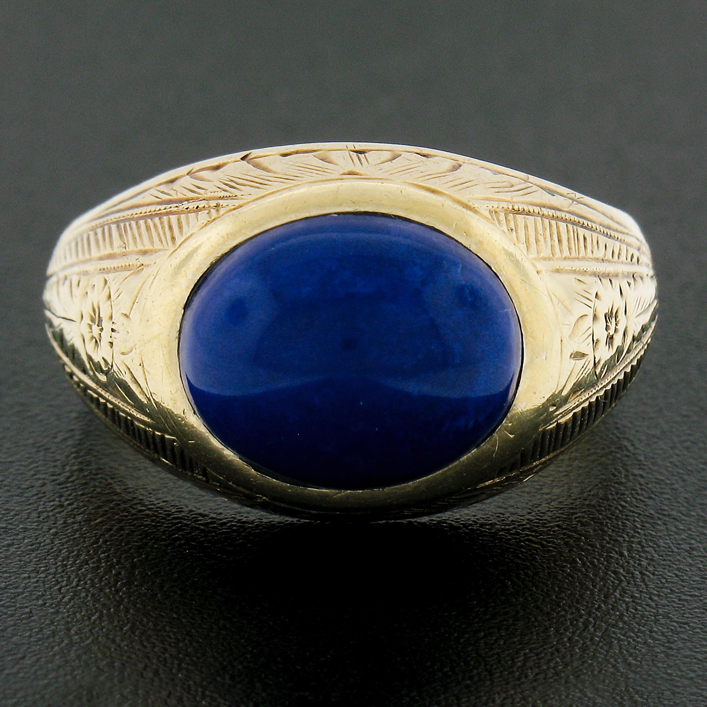 Here we have a magnificent antique men's ring that is crafted from solid 14k yellow gold and features a very high quality natural lapis solitaire neatly bezel set at the center. This oval cabochon cut stone displays a nice large size with an