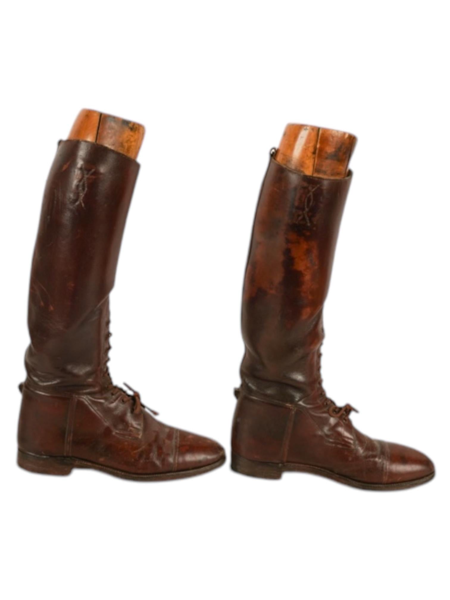 Step into history with these Antique Men's English Leather Riding Boots, a stunning relic of classic equestrian craftsmanship. Made from premium aged leather, these boots showcase the timeless elegance and durability expected of traditional English