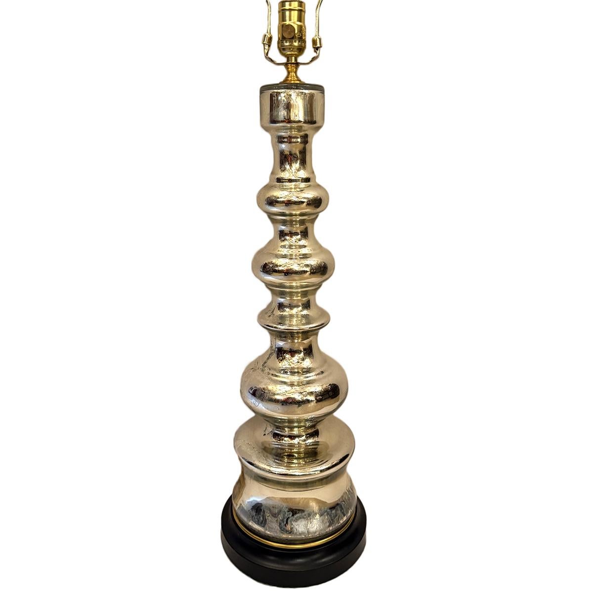 A circa 1930 French mercury glass lamp.
Measurements:
Height of body: 25