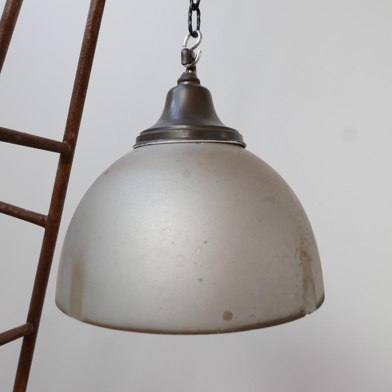 A large mercury glass reflector shade pendant lamp with patinated brass gallery. 

Germany, c1930s. 

Re-wired and PAT tested. 

Amazing condition, there is some evidence of age to the outside, but the shade could always be re-sprayed.
