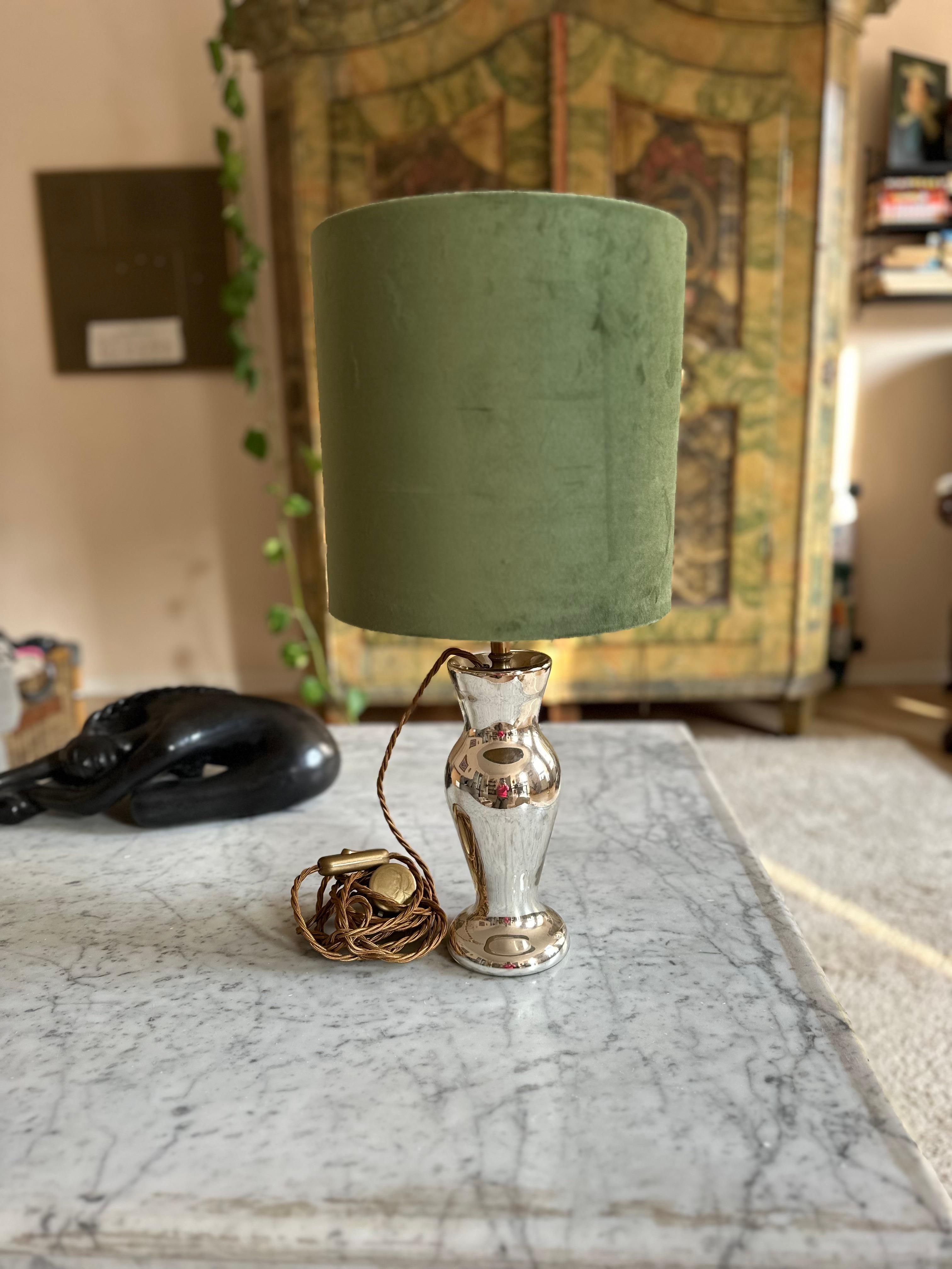 This stunning table lamp is crafted from an antique mercury glass candlestick, also known as Bauernsilber. This traditional silvered glass technique dates back to the 19th century and was originally developed as an affordable alternative to real