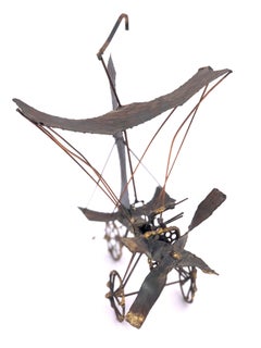 Escultura metálica antigua de hélice de avión