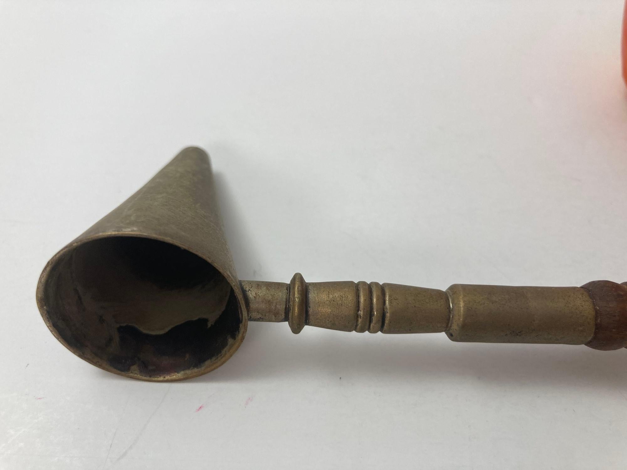 Antique Victorian silver plated and wooden handle candle snuffer.
Candle snuffer with carved wood long and hand carved handle.
Snuffers are great for extinguishing the flames of your tall tapers.
Will also work for votives and multi-wick