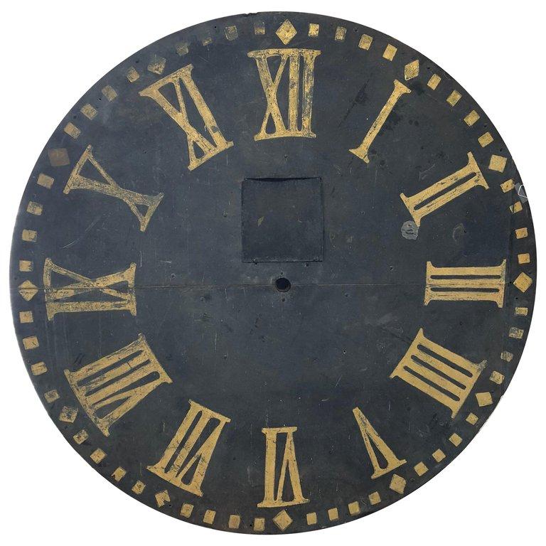 Face d'horloge en métal ancien